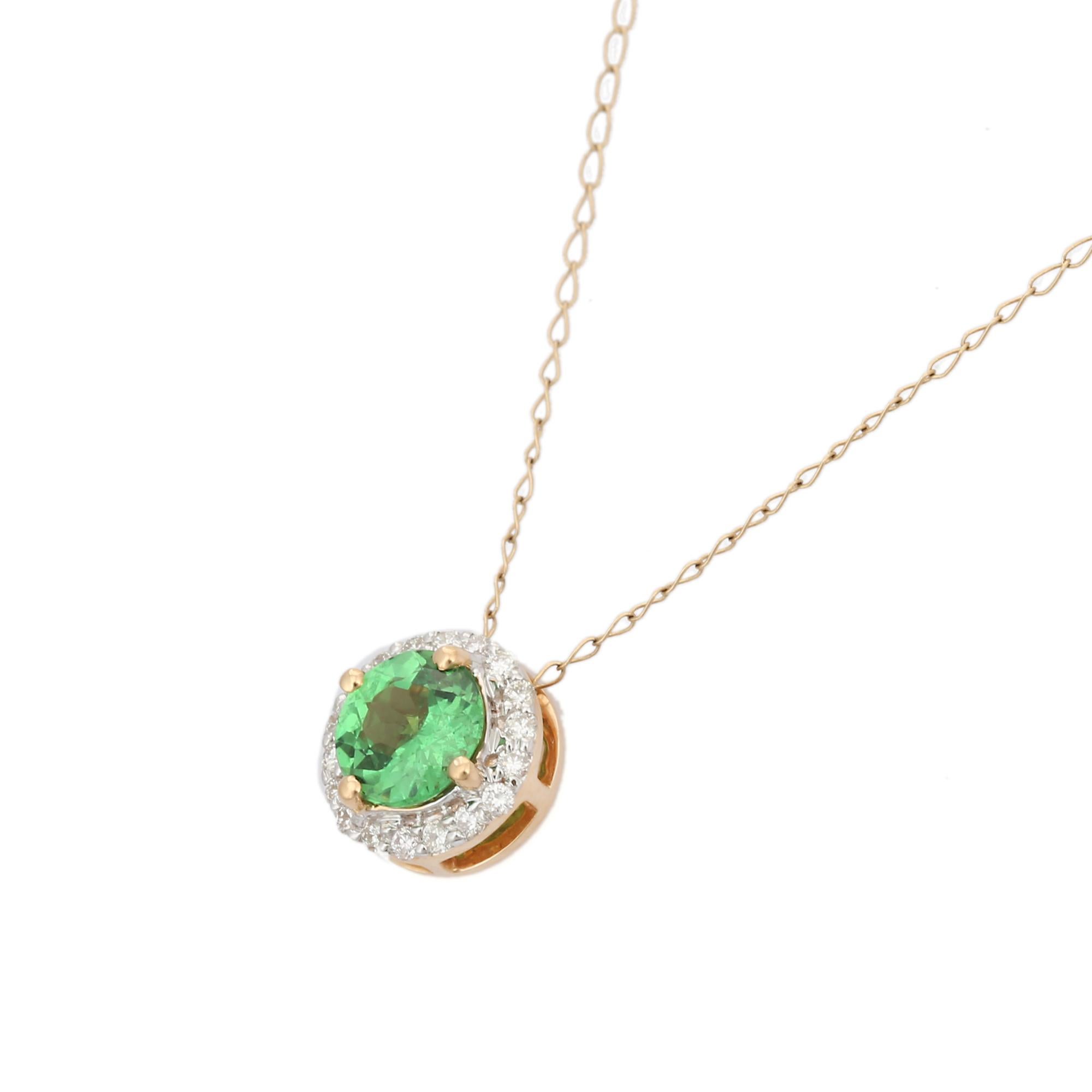 Halo Tsavorite Solitaire Necklace in 18K Gold with diamond studded around round tsavorite. This stunning piece of jewelry instantly elevates a casual look or dressy outfit. 
Tsavorite heals the heart chakra and facilitate communication. Designed