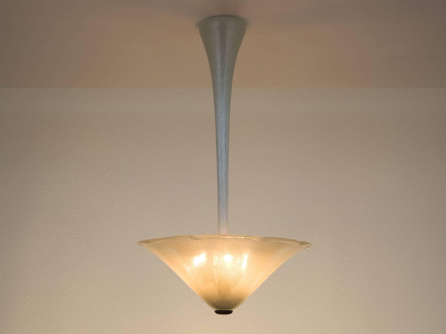 Pendant, Pulegoso glass, Italy, 1950s.

The organic, delicate shape of this chandelier resembles that of a flower or mushroom. Dropping from the sealing like a stem, the shade of the pendant shows an upward rise and fans out in a soft, natural way.