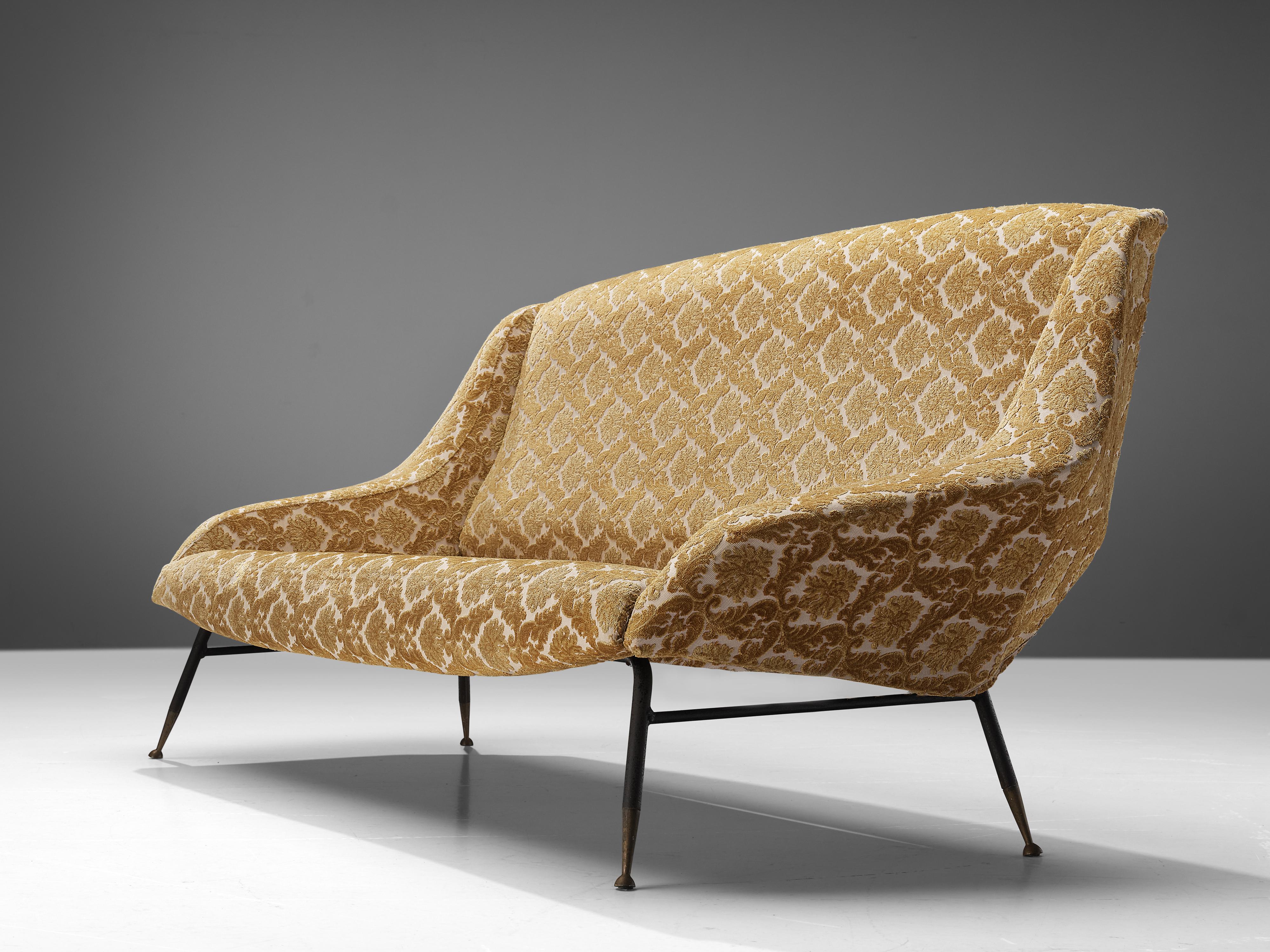 Sofa, brass, metal, fabric, Italy, 1950s 

This sofa was designed in Italy and shows similarities with the designs of Gigi Radice. The sofa is comfortable and has playful details. The sofa bends slightly backwards in order to make the perfect angle