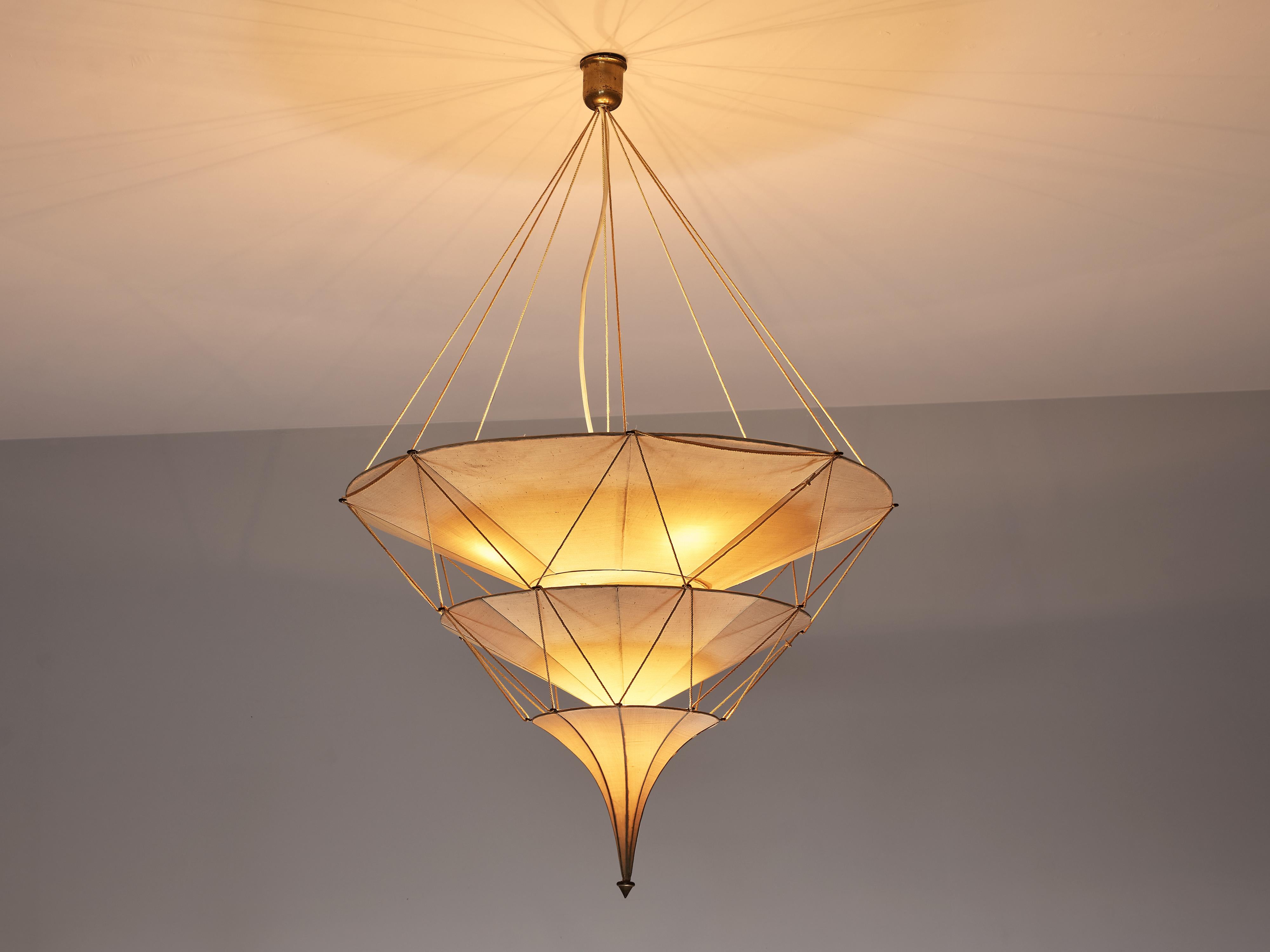 Mariano Fortuny, chandelier ‘Icaro’, silk, fibre, metal, brass, cord, Italy, designed 1920s

This elegant ‘Icaro’ chandelier by Mariano Fortuny was designed around 1920. It has a theatrical expression and atmospheric light. Three layers of shades