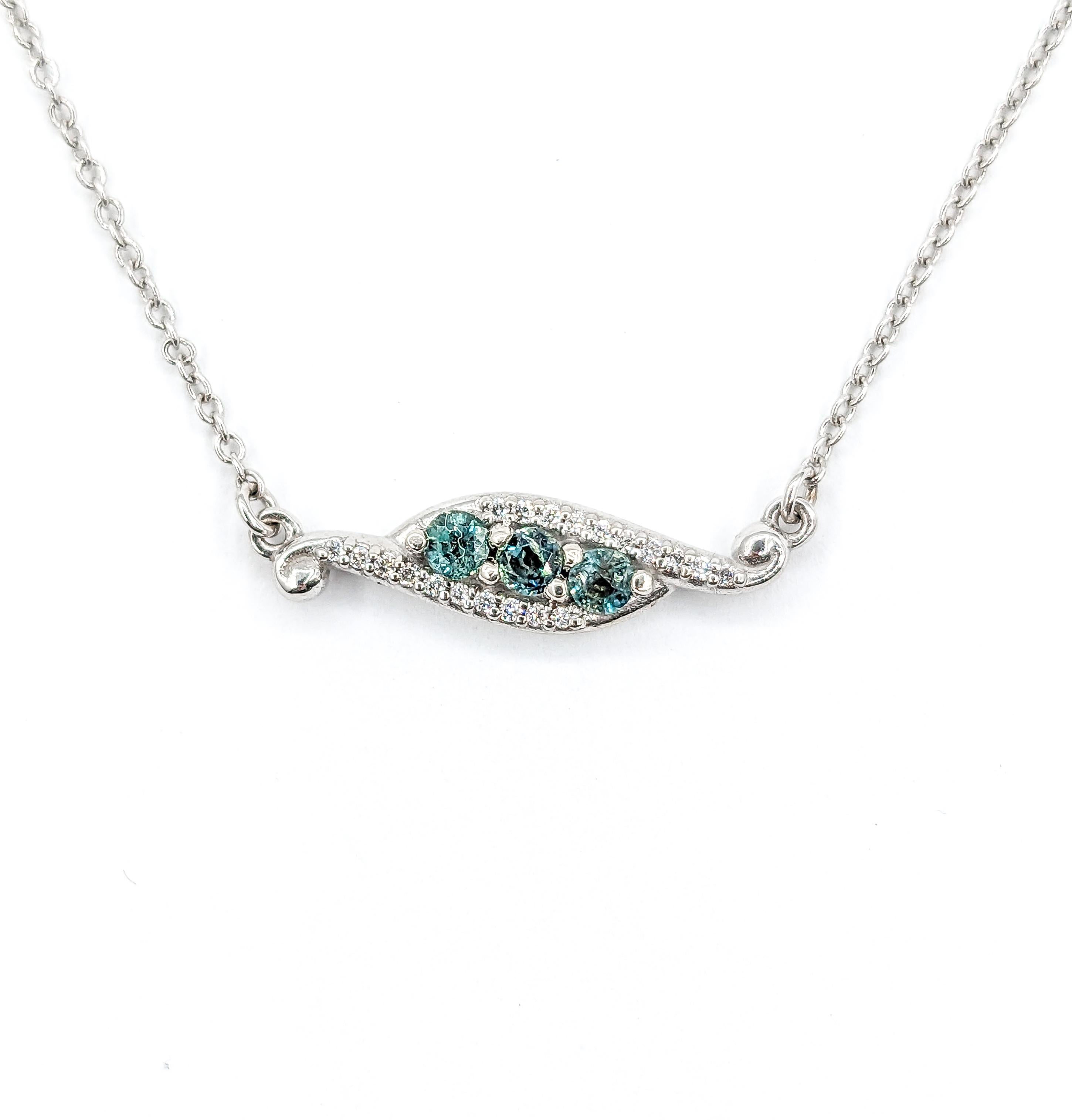 Delicate Natural Alexandrite & Diamond Station Necklace in White Gold

Introducing a stunning necklace, meticulously crafted in 14k white gold, featuring an elegant 3-Stone design with .04ctw round diamonds. These diamonds boast SI clarity and a