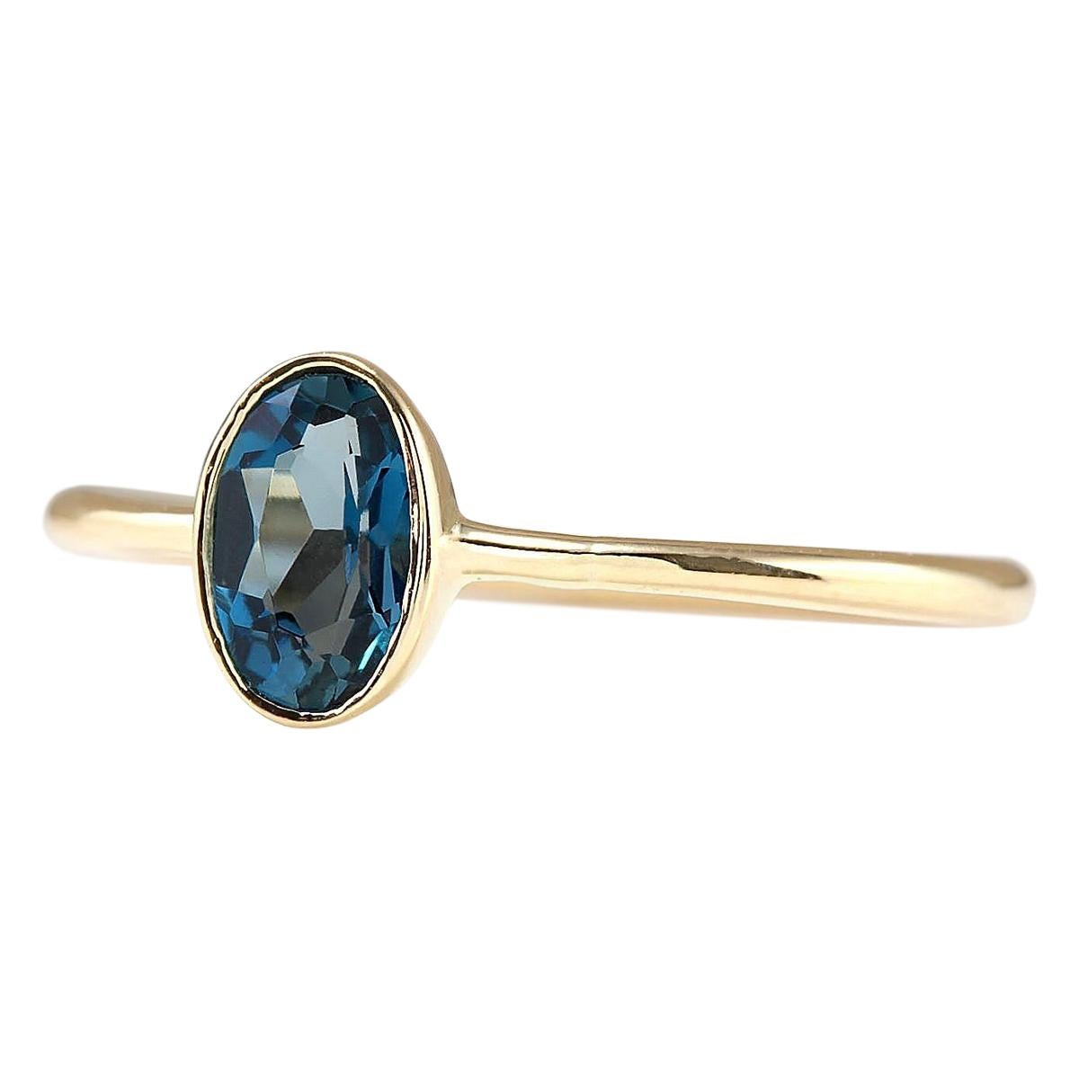 Introducing our charming 14 Karat Yellow Gold Ring adorned with a stunning 0.60 Carat Natural Topaz gemstone. Stamped for authenticity, this ring weighs a mere 1.2 grams, ensuring comfort and wearability. The Topaz gemstone, weighing 0.60 carats and