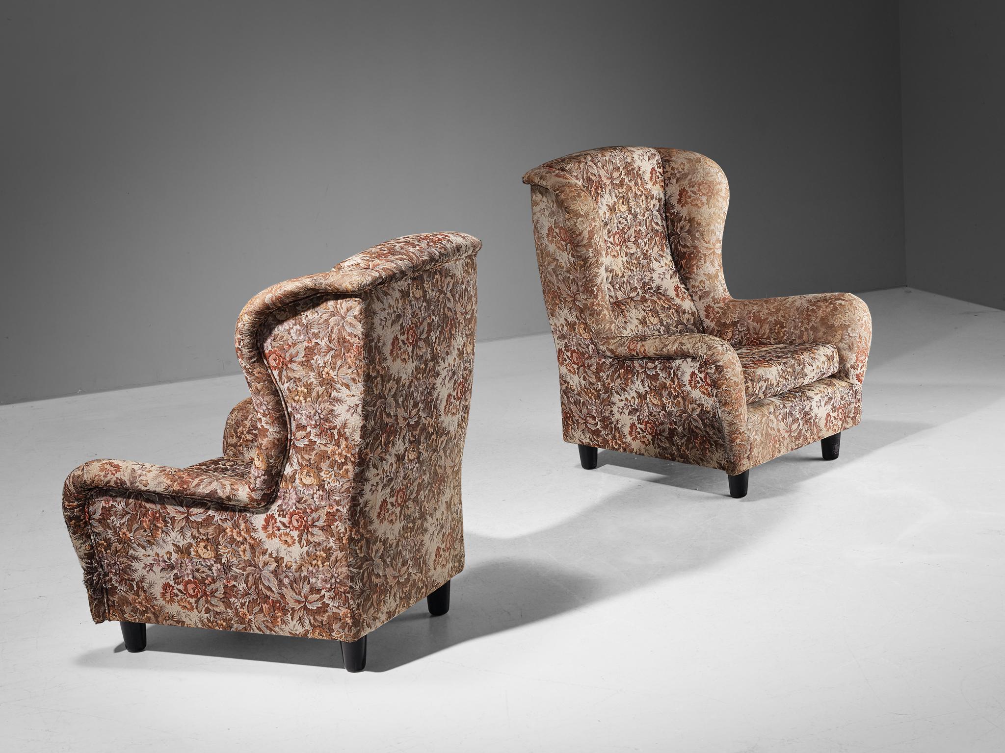 Pair of lounge chairs, fabric, lacquered wood, Czech Republic, 1940s 

These easy chairs are beautifully constructed featuring a shell shaped frame with sinuous ears that bring a more open and inviting look to the quite solid design. The upholstery