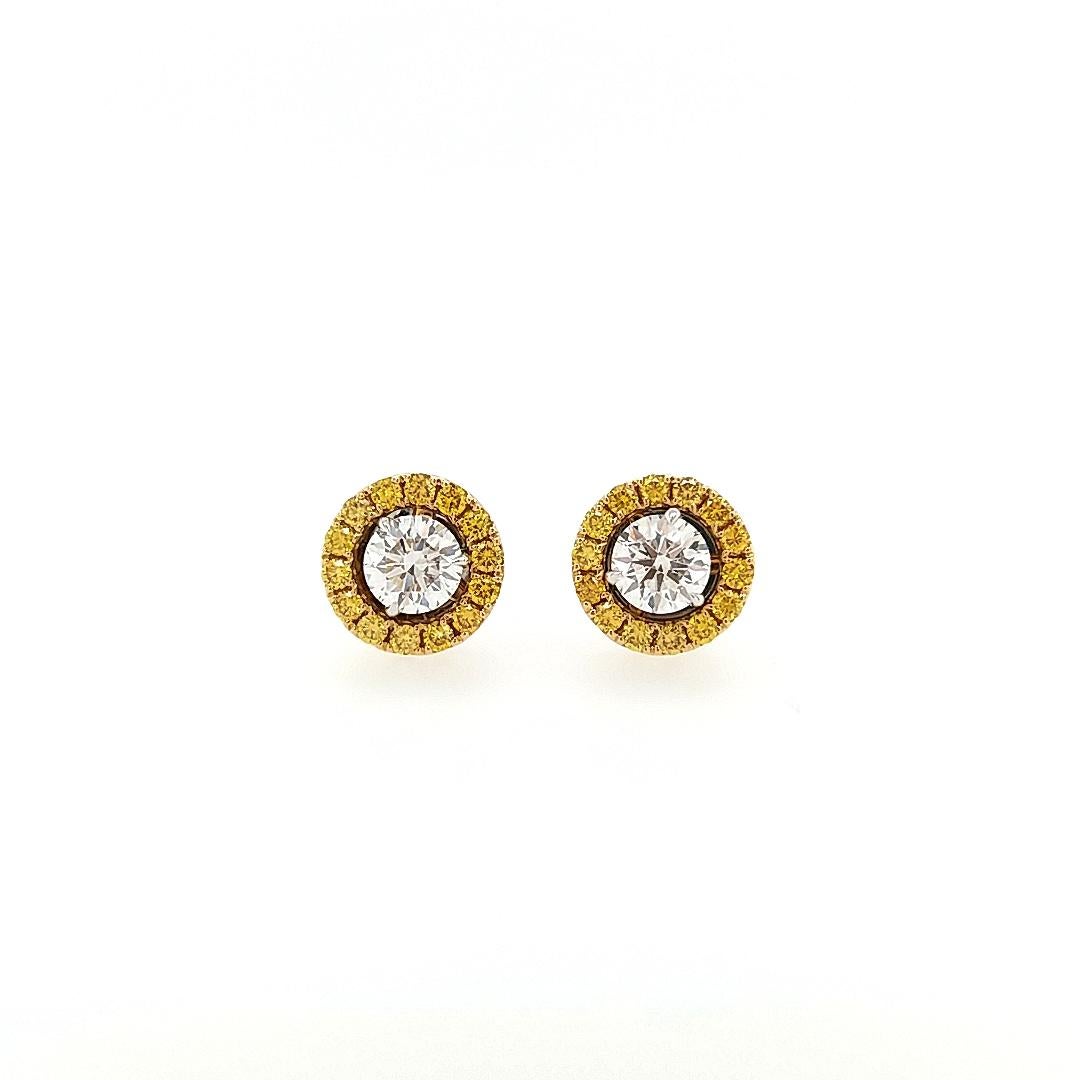 This charming pair of White and yellow diamond Earrings is set in a unique style, with an adjustable halo of Yellow diamonds.

Center White Diamond -  0.60 CT/ VVS1 (GIA certified)
Yellow Diamonds - 0.30 CT
Made in K18WG/YG

HYT Jewelry is a Fine