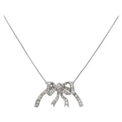 Delicate Platinum and 18 Karat White Gold Necklace with a Diamond Set Bow