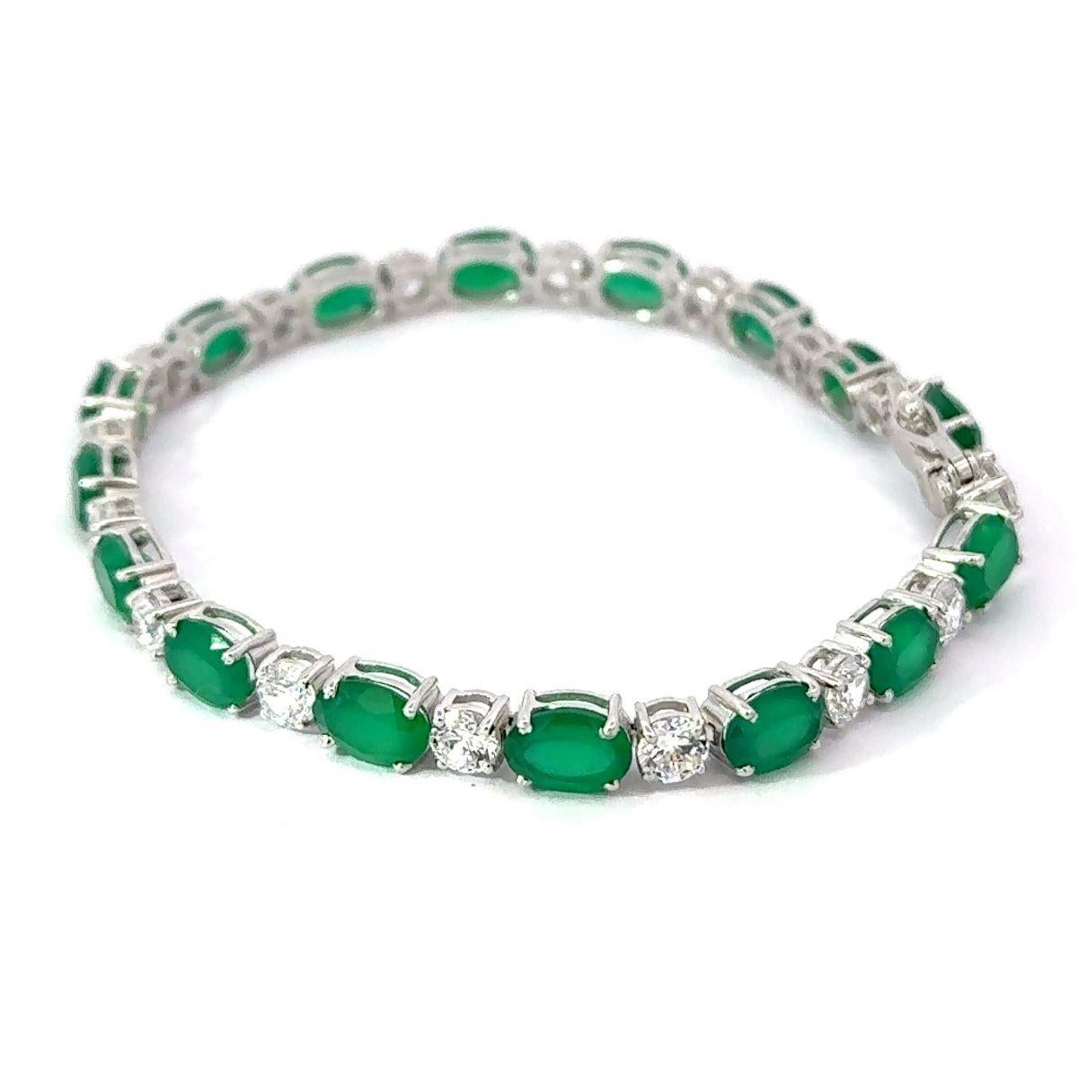 Modernist Delicate Prong Set Emerald Birthstone Silver Tennis Bracelet for Graduation Gift For Sale