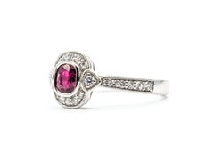 Delicate Ruby & Diamond Halo Ring in Platinum