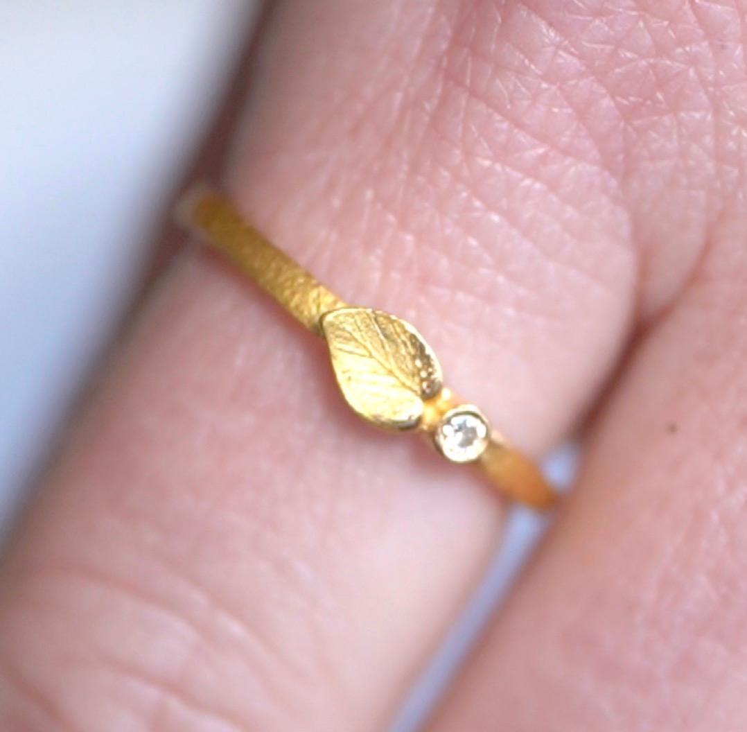 Delicate Leaf and Diamond Ring in 24kt Solid Gold by Prehistoric Works of Istanbul, Turkey. 1 Diamond - 0.03cts, 2.72 grams of 24kt gold. Pairs well with stacking with other bands. Size 8 US