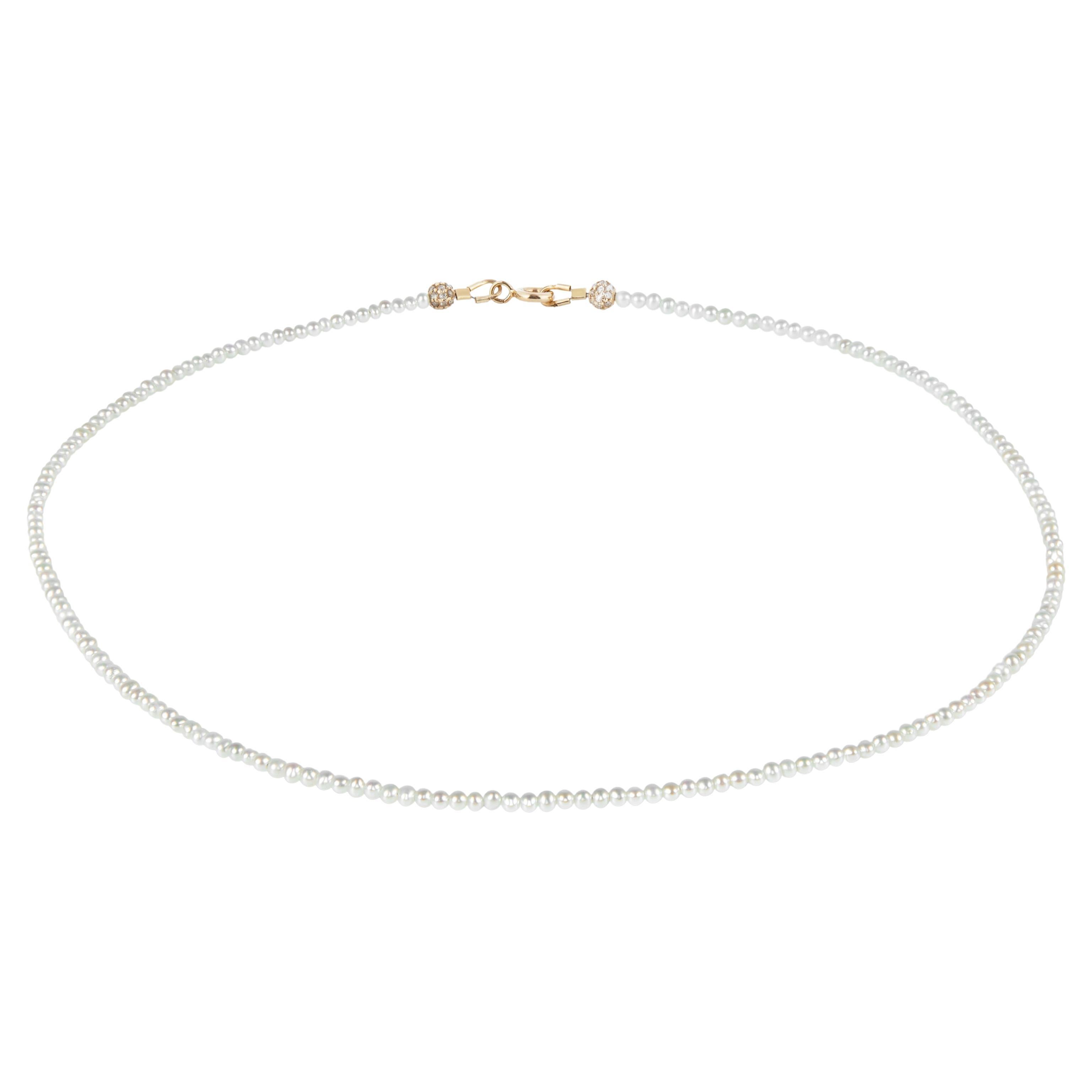Delicate white freshwater pearl necklace with 14k gold closure For Sale