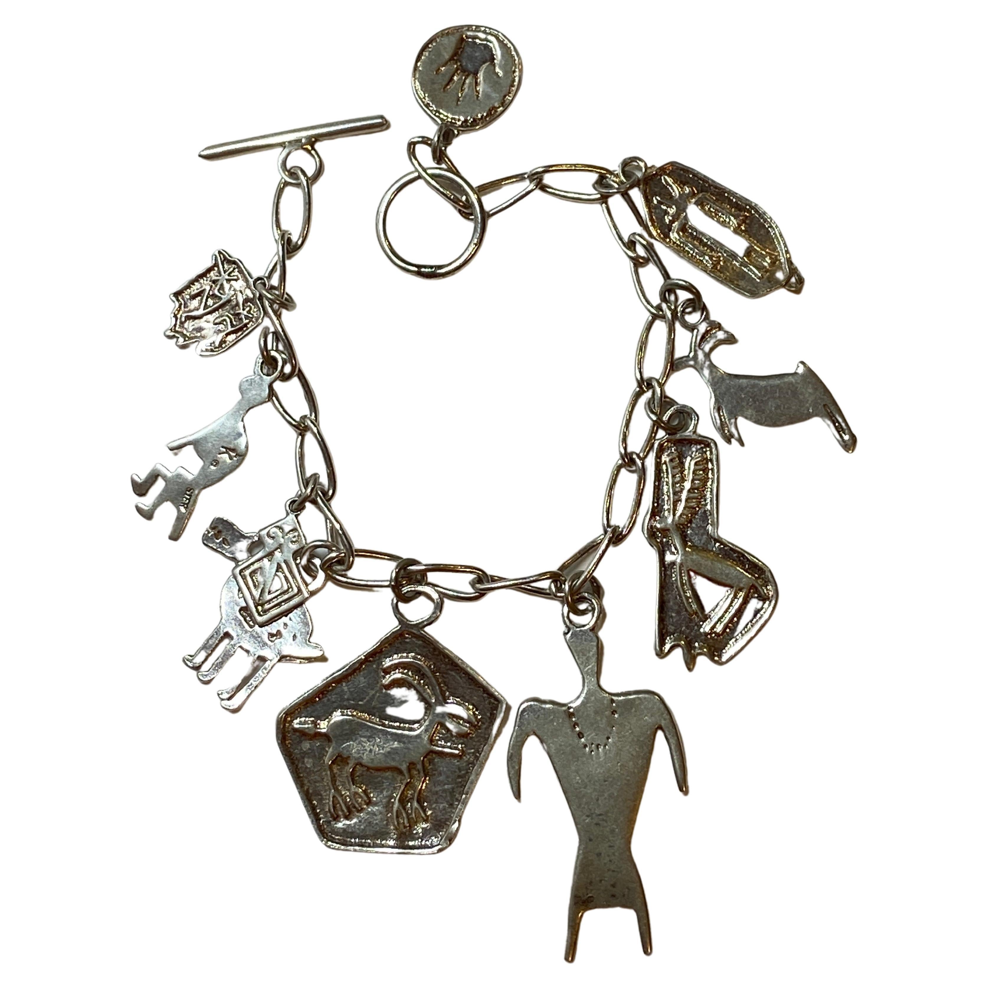 Delicately Whimsical Sterling Silver Charm Bracelet For Sale