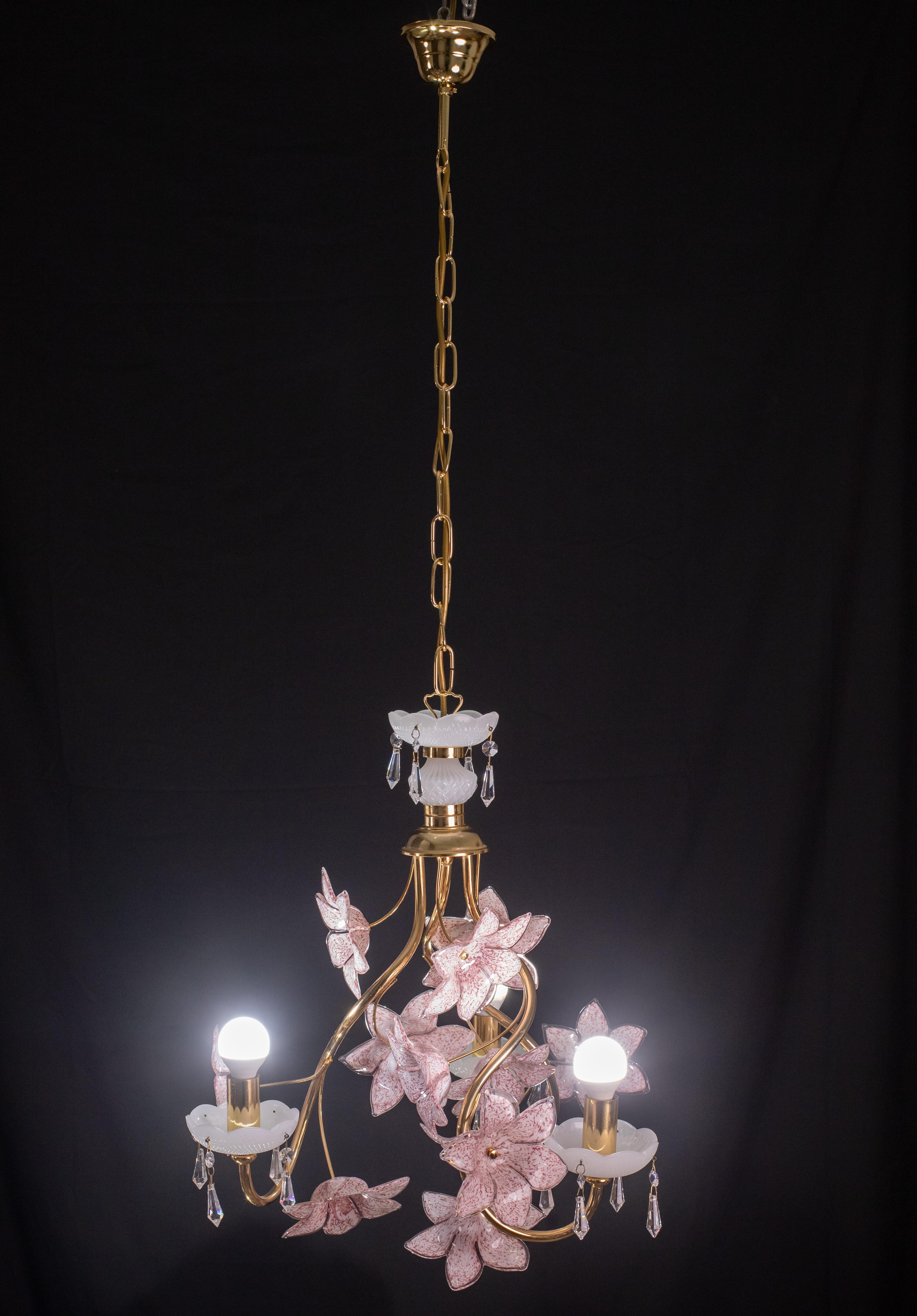 Vintage Murano glass chandelier with pink flowers.
The chandelier has 3 light point with E14 socket.
The frame is made of gold bath and is in good vintage condition.
The height of the chandelier is 115 cm, the diameter is 55 cm, the height without