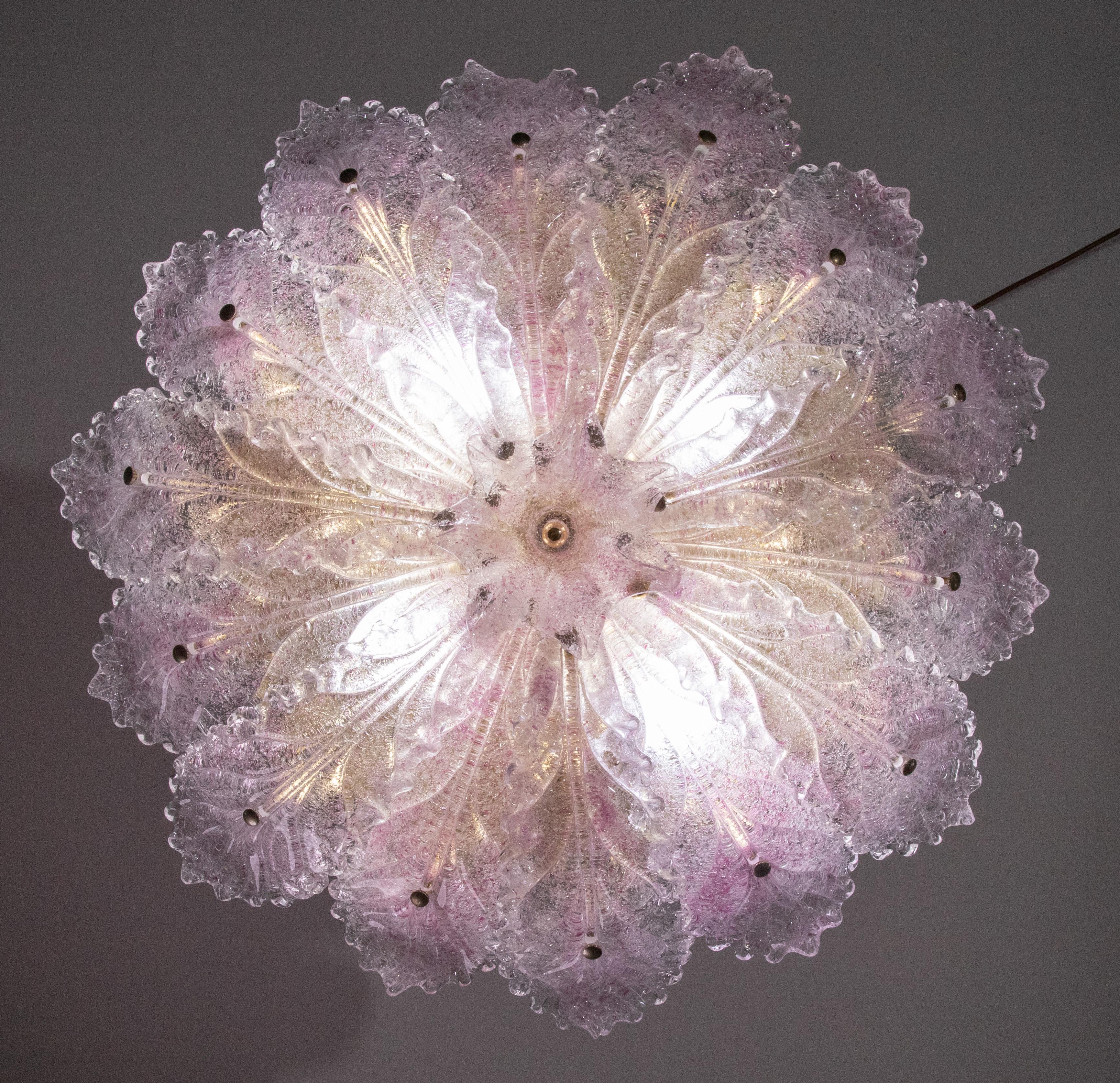 Elegant Vintage Murano ceiling light with pink glass and gold bath structure.

Period: circa 1970.

The ceiling light features 4 European standard E14 lights.

Good vintage condition, however there is a slight chip on the glass visible in the last