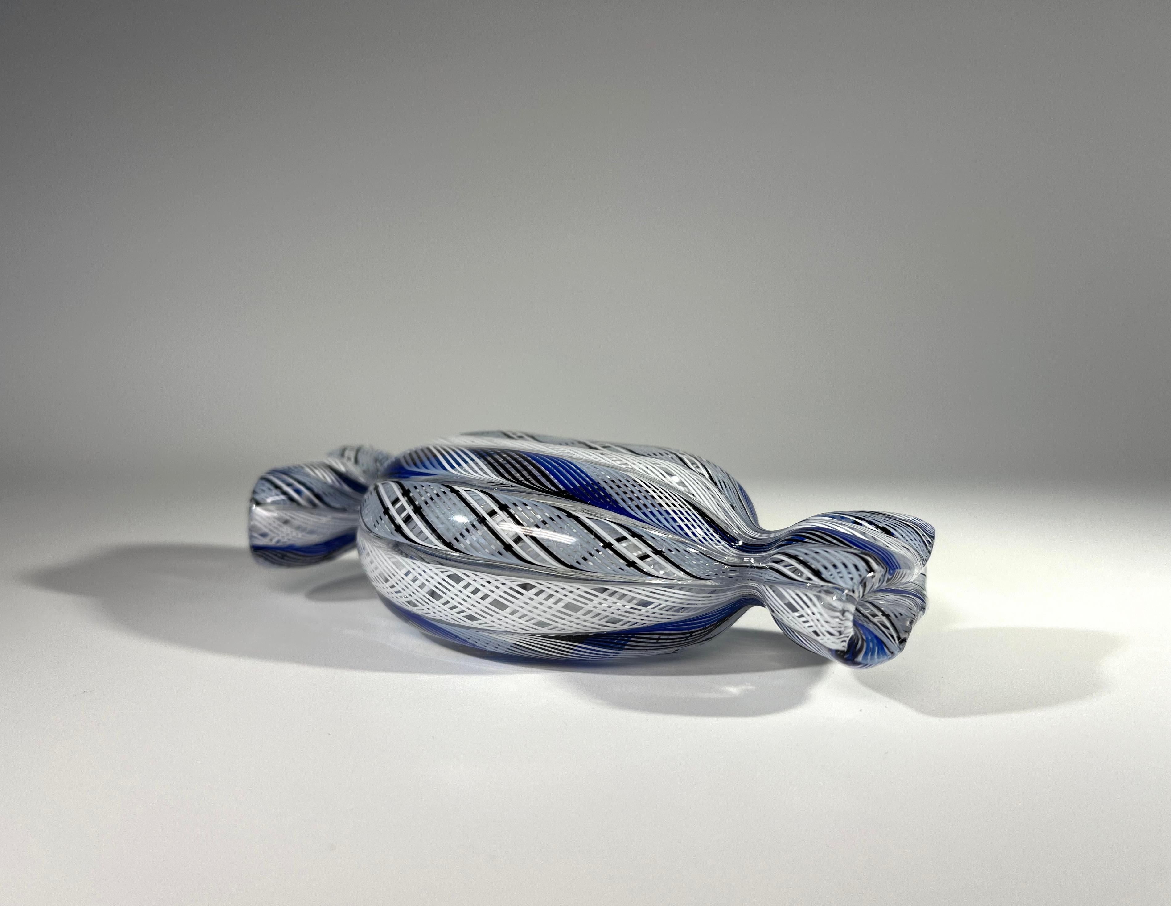 Incredibly intricate blue, black and white Zanfirico canes are worked to create a delicious hand blown glass sweetie 
Crafted by the renowned glass artist, Mike Hunter of Twists Studio in Scotland
Has original Twists studio label
Circa