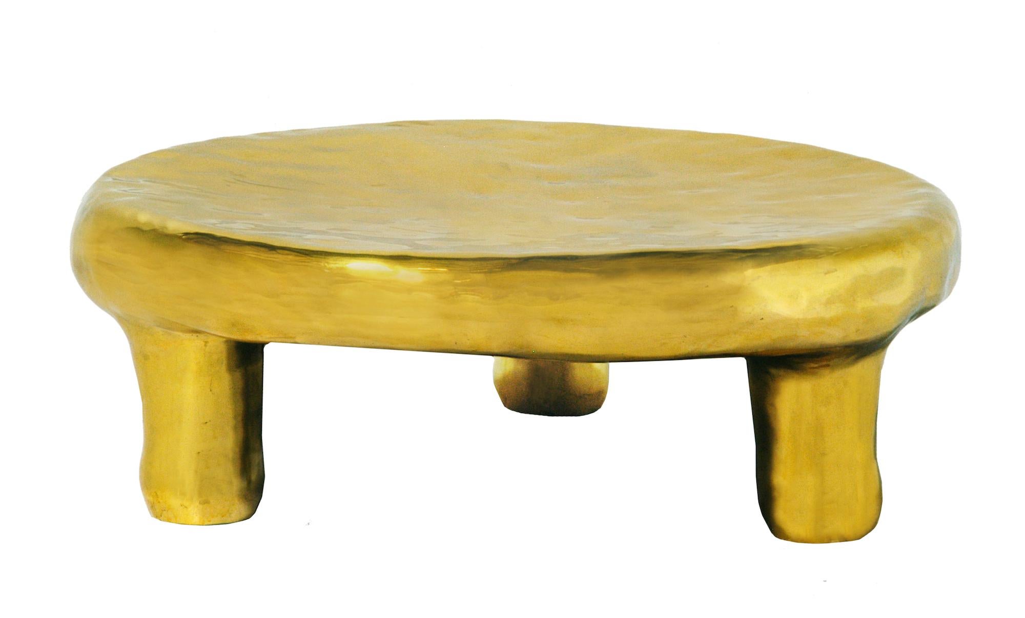 Delight Coffee Table in Brass by Scarlet Splendour is a round coffee table, gorgeous in any interior space. 

The Fools' Gold Collection of amorphous forms, cast in brass, is a tribute to the heritage of Indian metal craftsmanship. India, in fact,