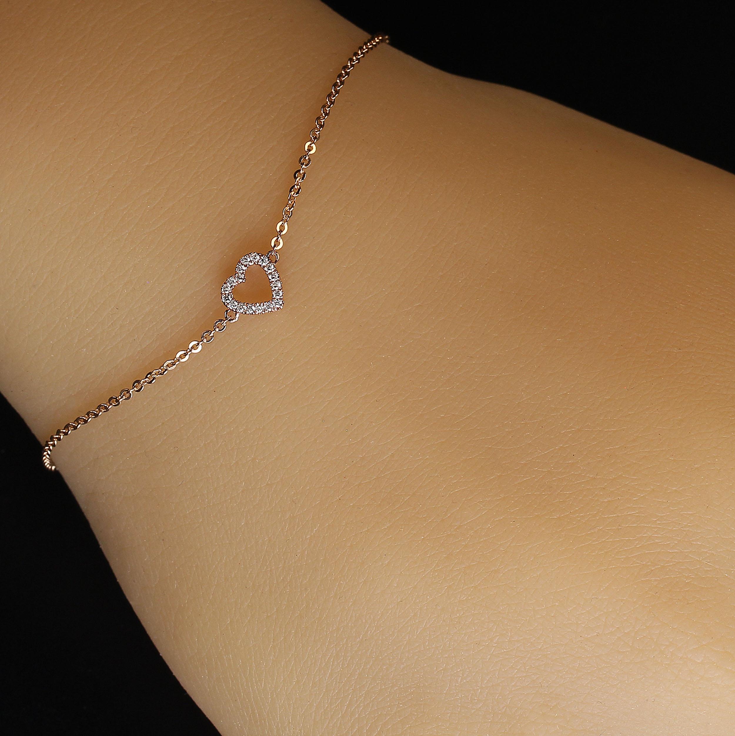 14K Rose Gold Bracelet or Ankle Bracelet with Diamond heart in 7 inch sparkling chain. The delicate heart features 0.07carats of diamonds. The chain is 7 inches with stations at 6 and 6.5 inches.  Wear this must have bracelet all day and all