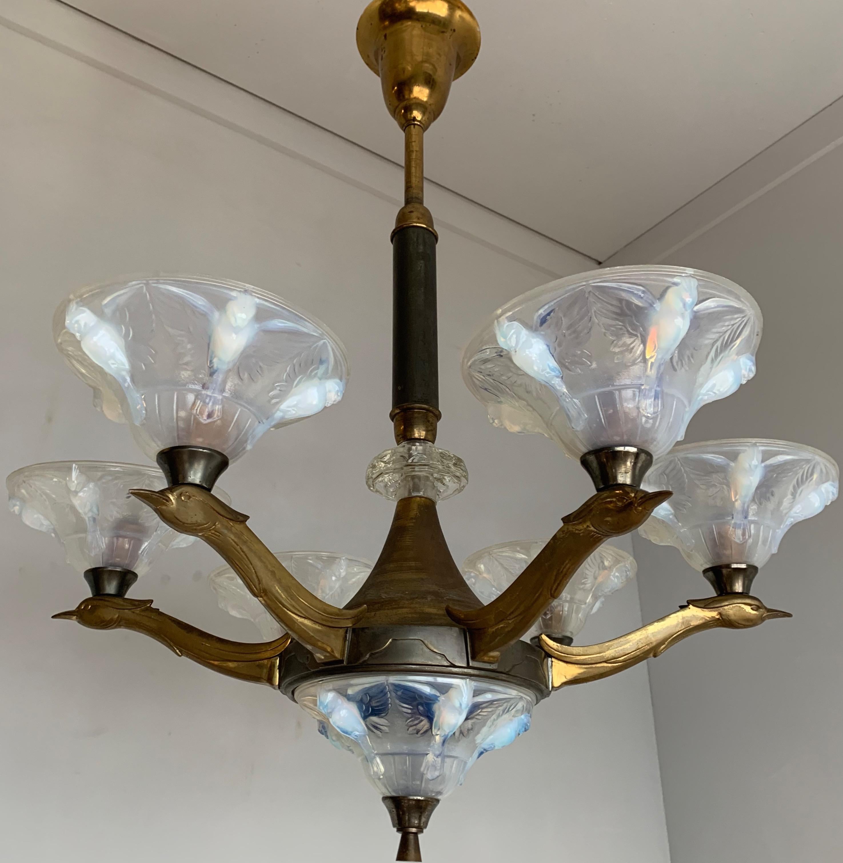 Very stylish and rare, 1920s Art Deco pendant light with a beautiful patina.

When we first saw this rare, sizeable and highly decorative Art Deco pendant we immediately knew it had to become ours. The wonderful design and the beautiful materials
