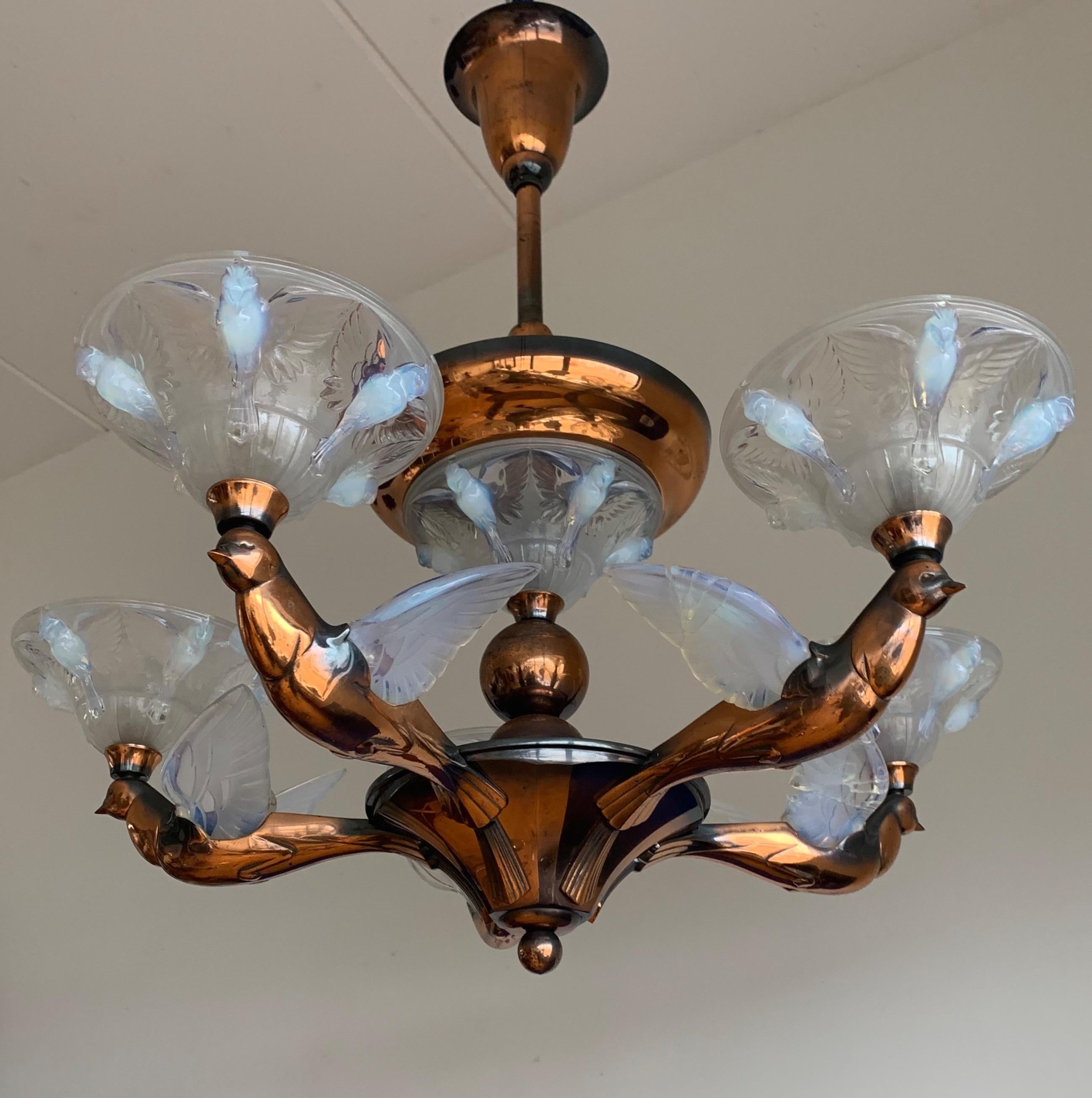 Very stylish and rare Art Deco pendant light with a beautiful patina.

When we first saw this rare, sizeable and highly decorative Art Deco pendant we immediately knew it had to become ours. The wonderful design and the beautiful materials