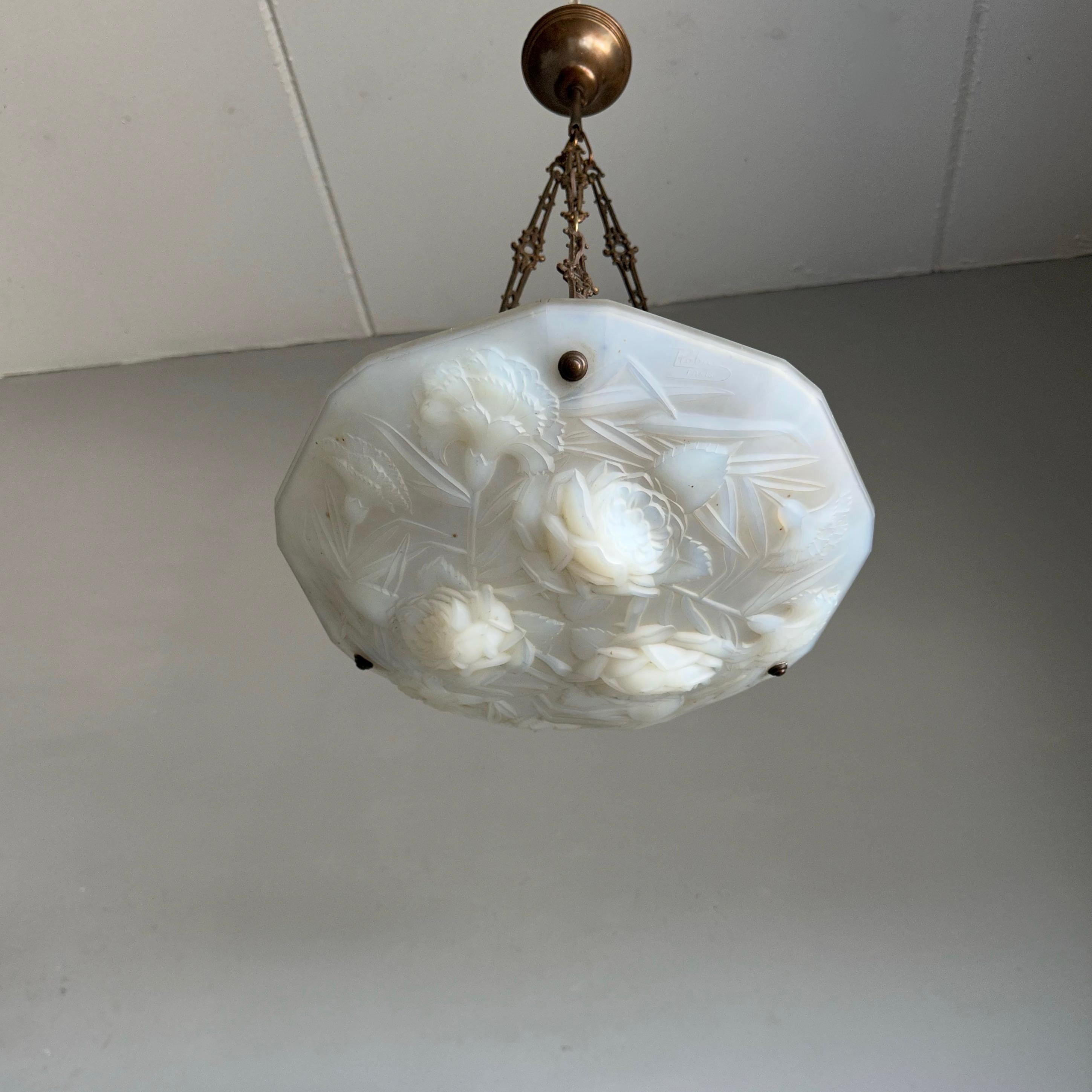 Very stylish and rare, 1920s Art Deco pendant light with a beautiful color.

When we first saw this rare, practical size and highly decorative Art Deco pendant we immediately knew it had to become ours. The wonderful design and flower patterns