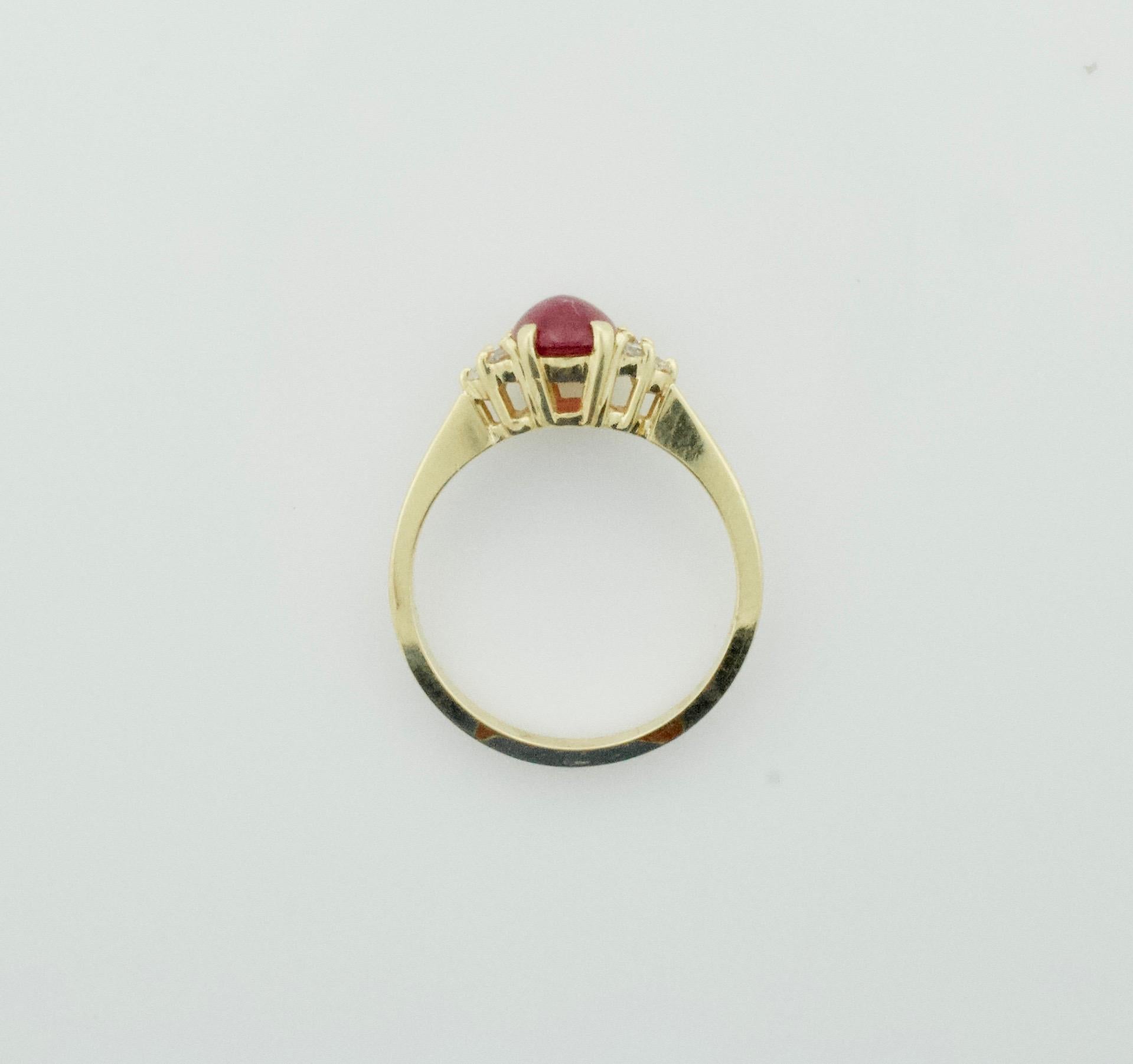 Modern Delightful Cabochon Ruby and Diamond Solitaire Ring in 18 Karat For Sale