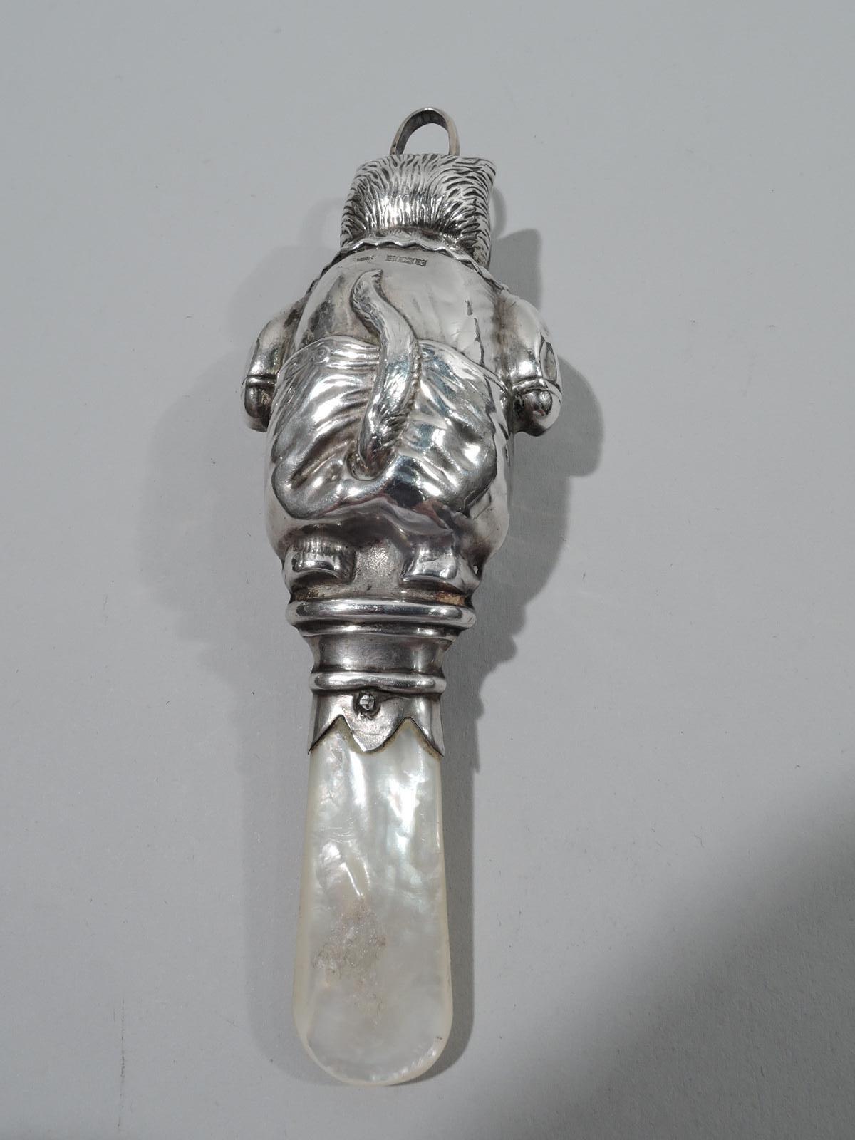 Delightful Victorian sterling silver rattle. Made by WH Collins & Co. in Birmingham in 1897. Kitty stands stiffly in snug fitting jacket and trousers. Only the tail is free to flick back and forth. A funny depiction of feline ill grace. A bit of a