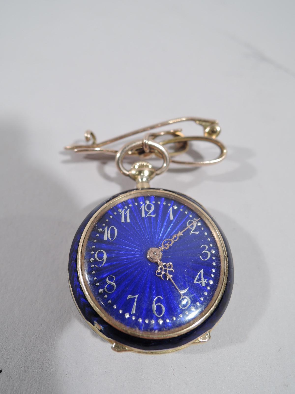 Delightful French 18k gold and cobalt blue enamel pendant watch with 9k bow mount. Guilloche face with 2 pierced hands and Arabic numerals. Back inlaid with rose-cut diamonds and rubies forming a fleur de lis. Vive la France! Interior has engraved