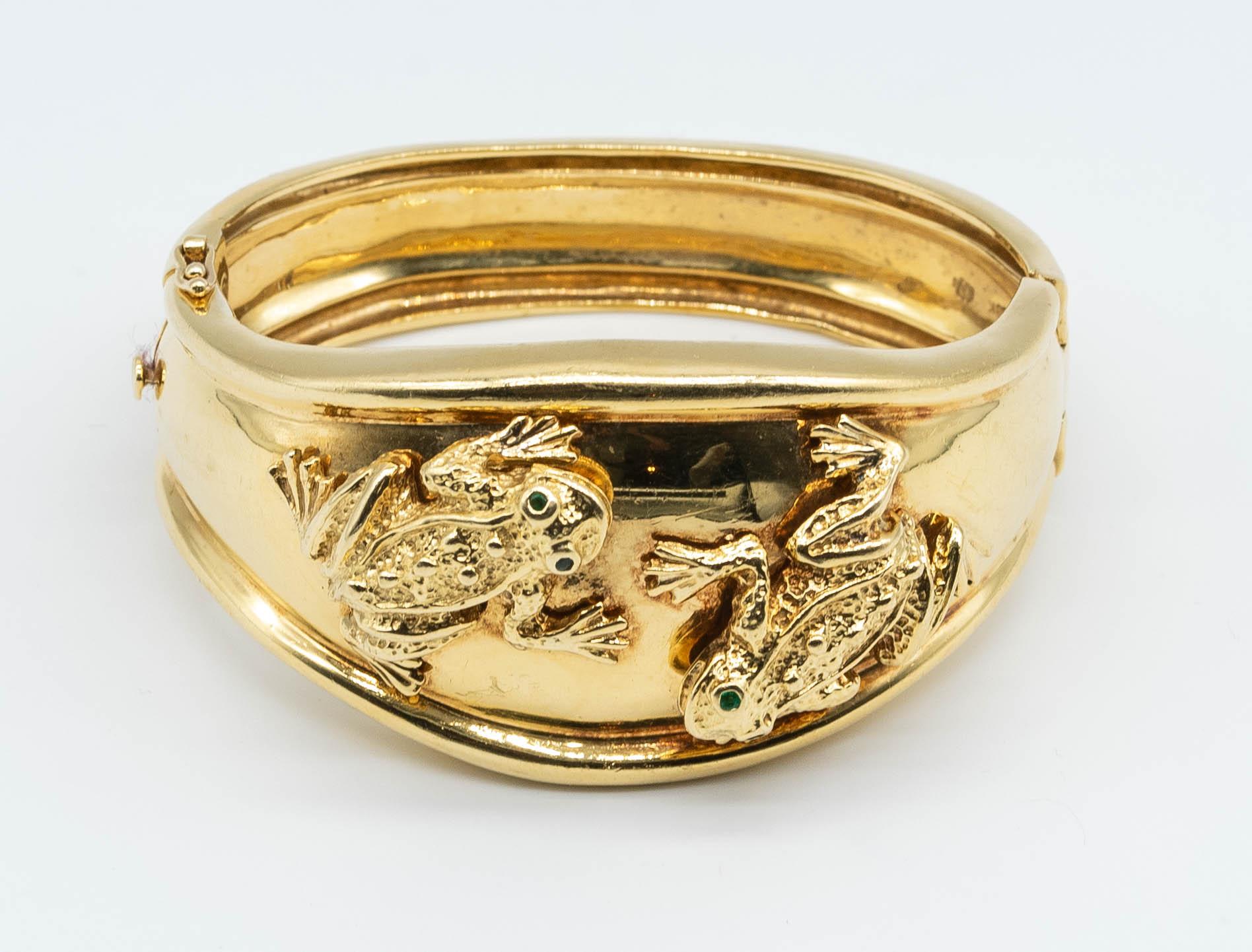 Frog motifs have been present in design for thousands of years.  This wee amphibian comes rife with symbolism: good luck, prosperity, fertility, happiness, and one sees it in numerous cultures.  In this case,  two beautifully crafted gold frogs
