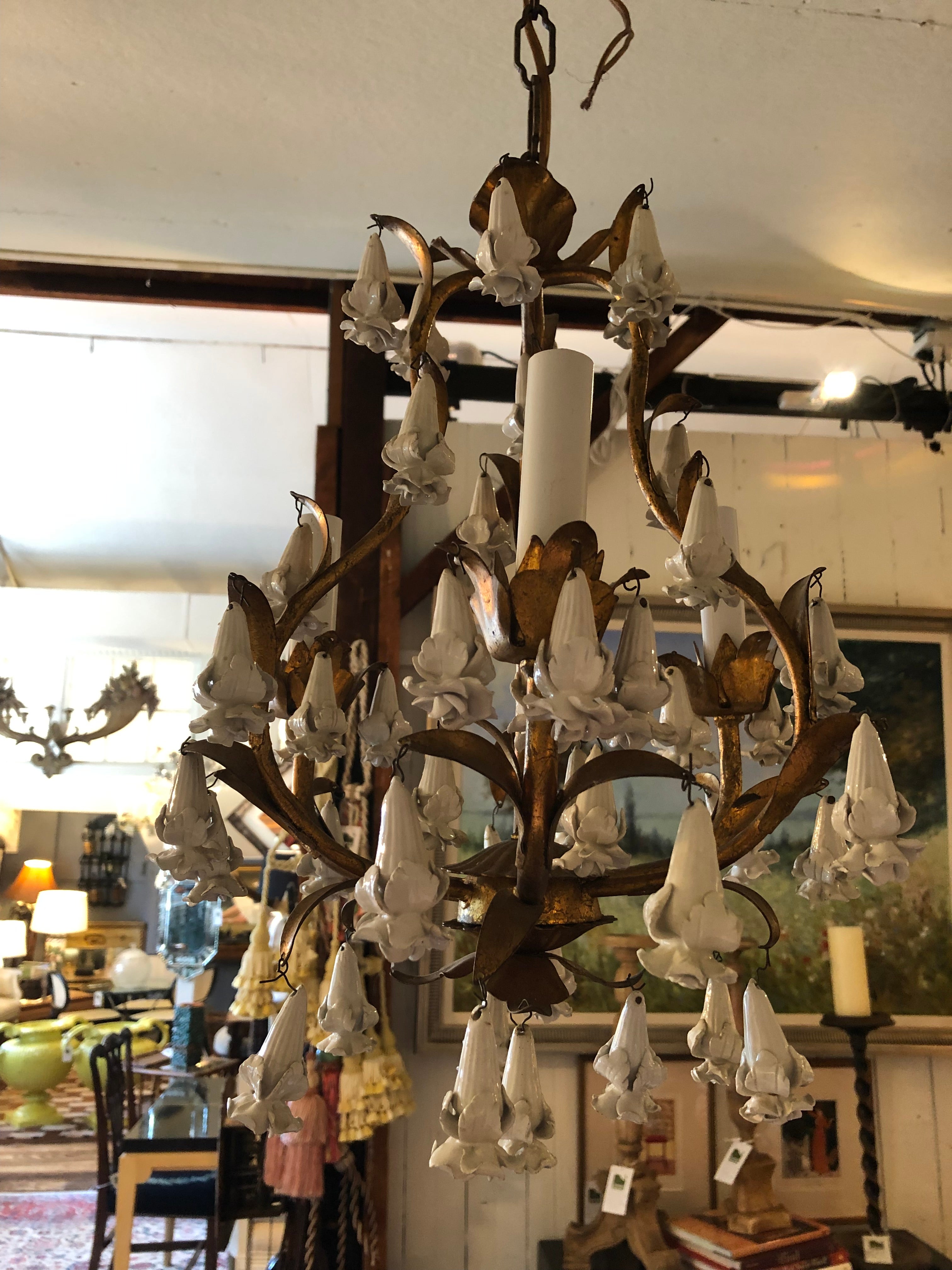 Lovely small Italian giltmetal 3 light chandelier with a multitude of dripping white porcelain tear shaped flowers. 12