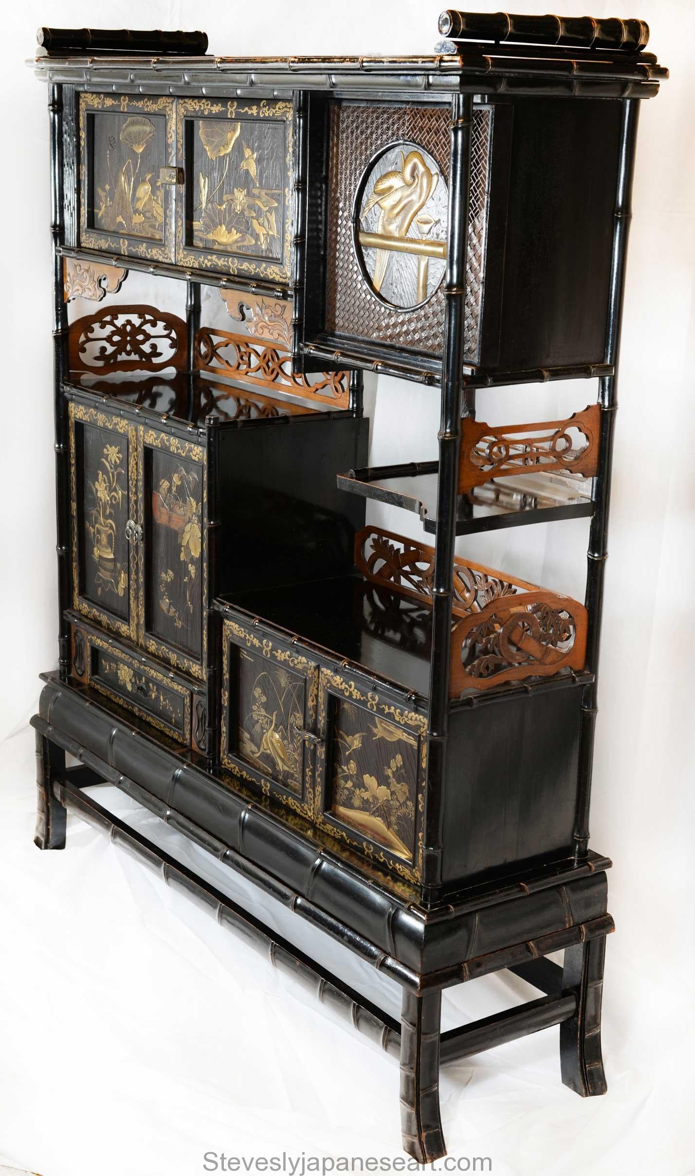 As part of our Japanese works of art collection we are delighted to offer this fine quality Meiji period 1868-1912, circa 1890 Kazaridana (display cabinet), the black lacquered hardwood cabinet stands upon a separate base formed as simulated bamboo,