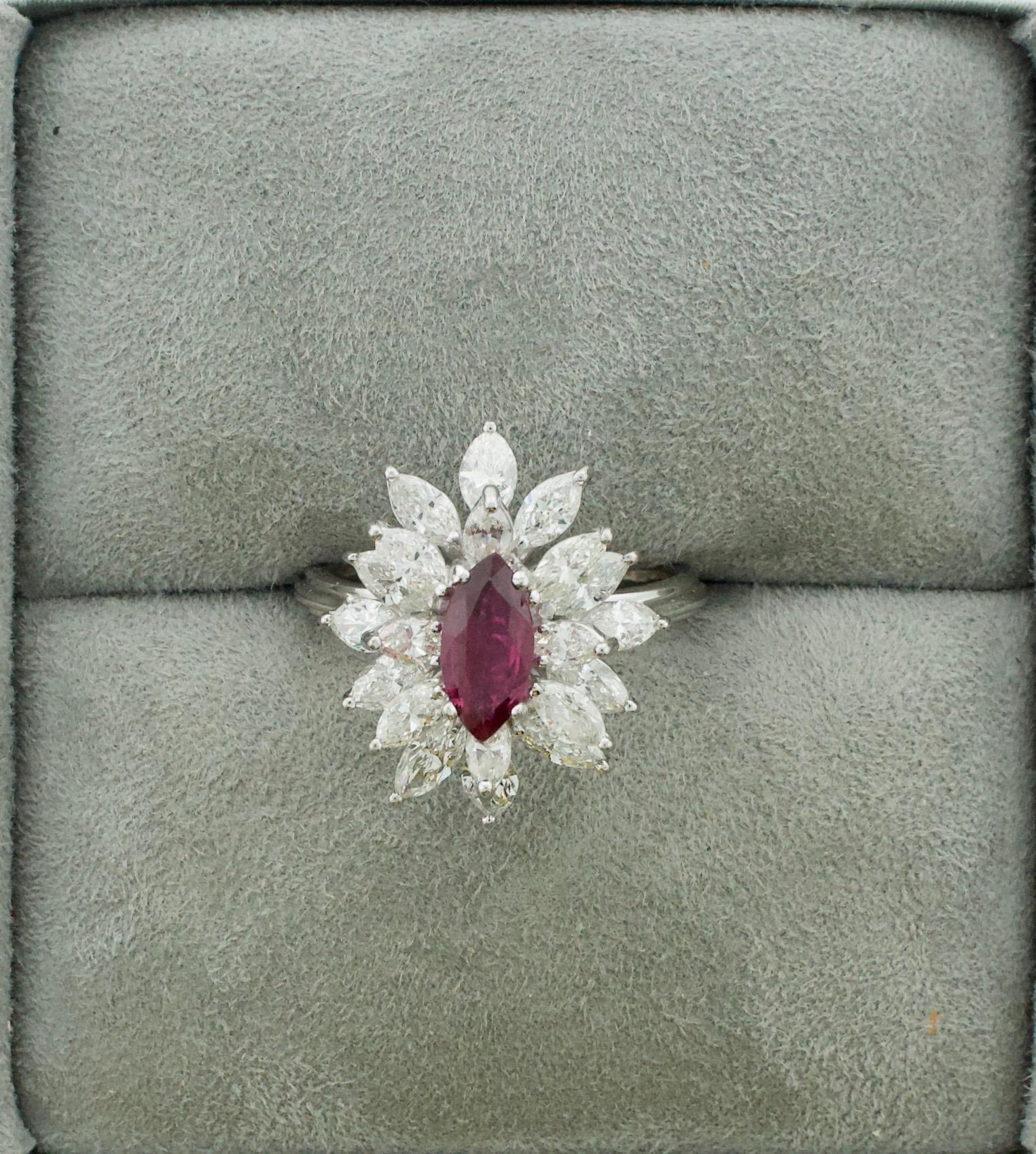 Delightful Marquise Cut Ruby and Diamond Cocktail Ring in 18k
One Marquise Cut Ruby Weighing 1.00 (approximately) [bright with no imperfections visible to the naked eye]
Twenty Marquise Cut Diamonds weighing 1.80 carats approximately [GH VVS-VS1