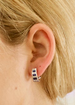 Delightful Sapphire and Diamond Earrings by "DeHago" in White Gold