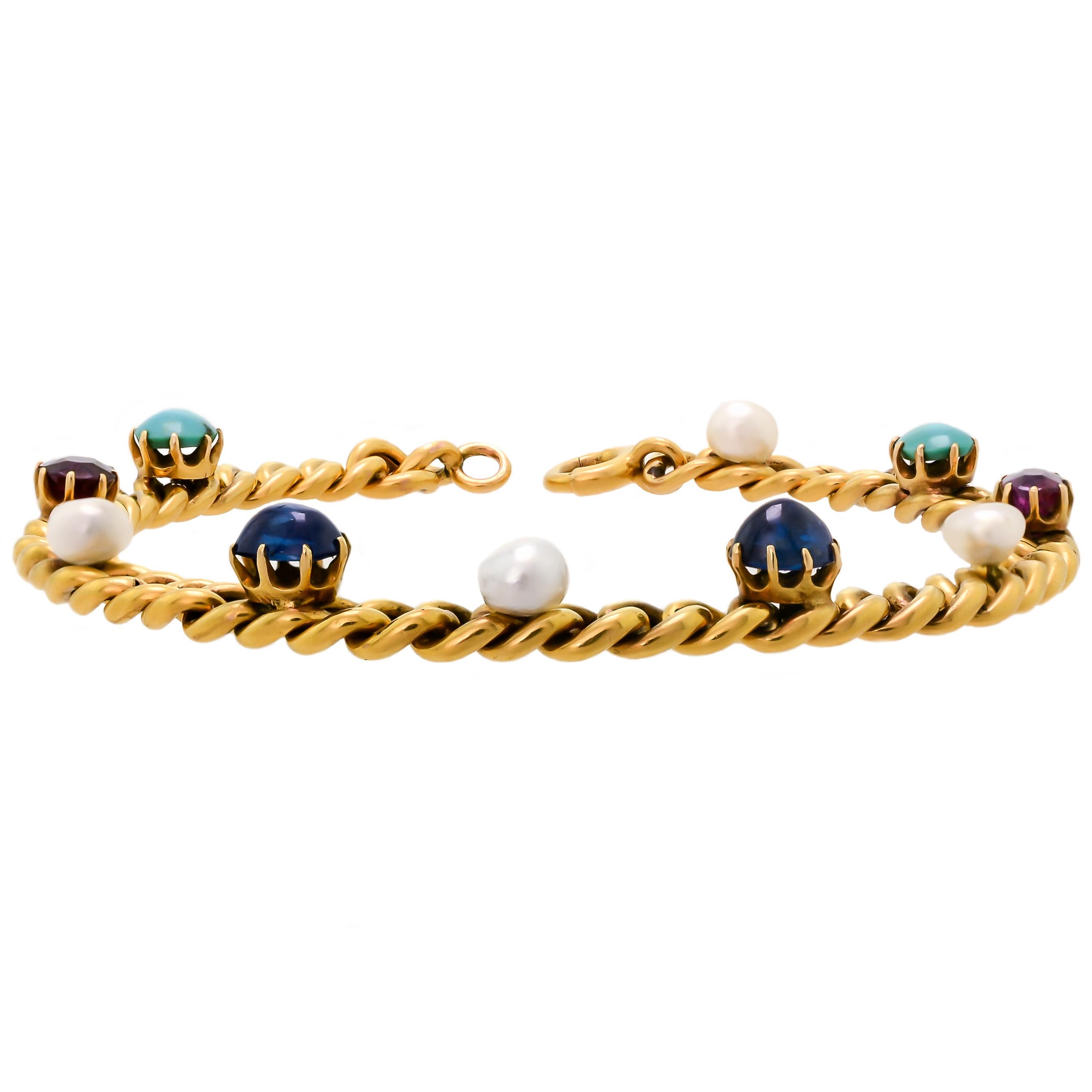 This charming and delightful Victorian 18 karat yellow gold curb-link gem-set bracelet is a beautiful and wearable piece. Set with alternating cabochon turquoise, cabochon sapphires, faceted rubies, and pearls these gems stand out against the rich