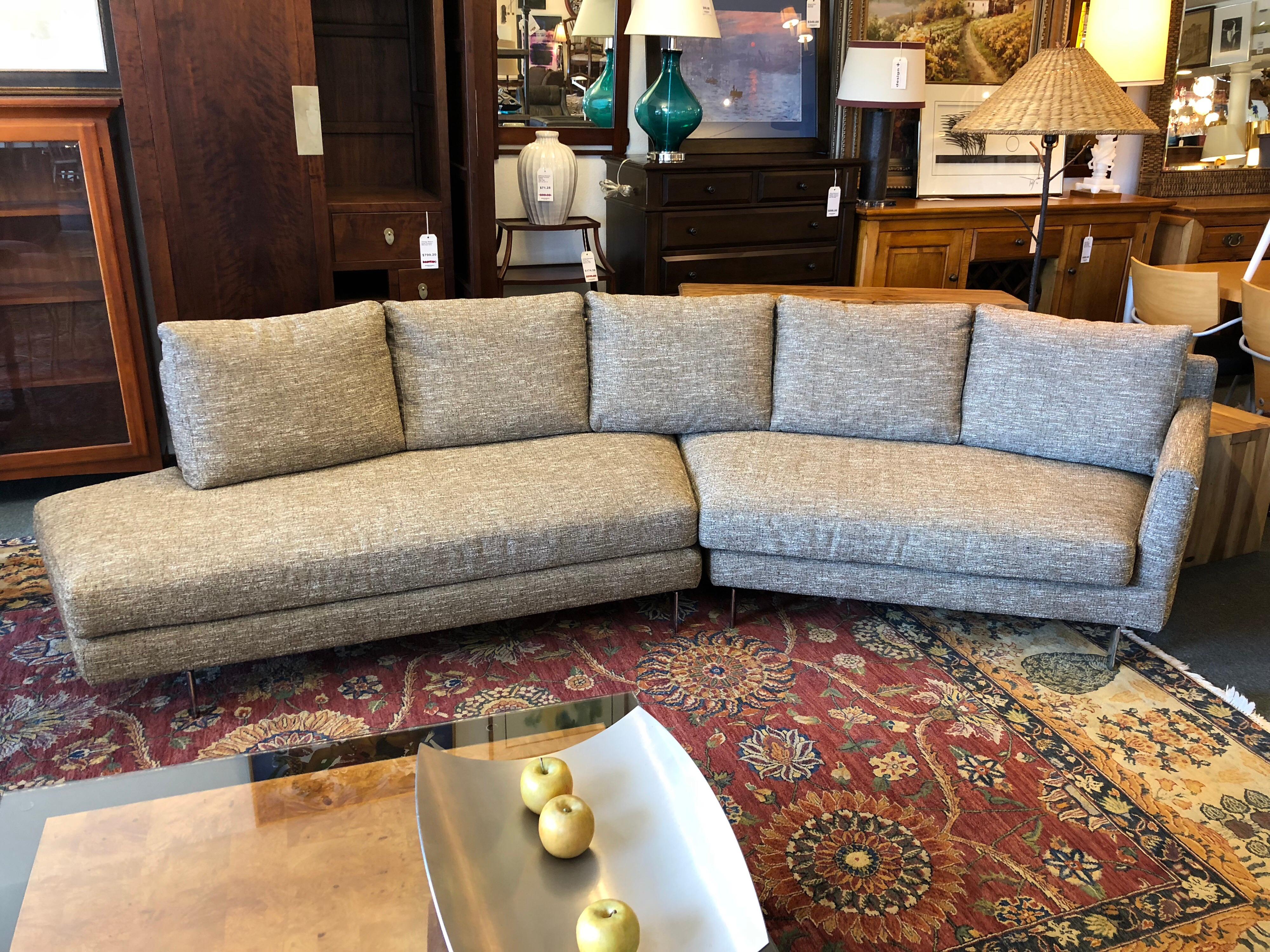 A new Alexa sectional, by Della Robbia. This two-piece invites conversation, with angled arrangement, down and feather cushions and textured upholstery. Crafted of hardwood with 3