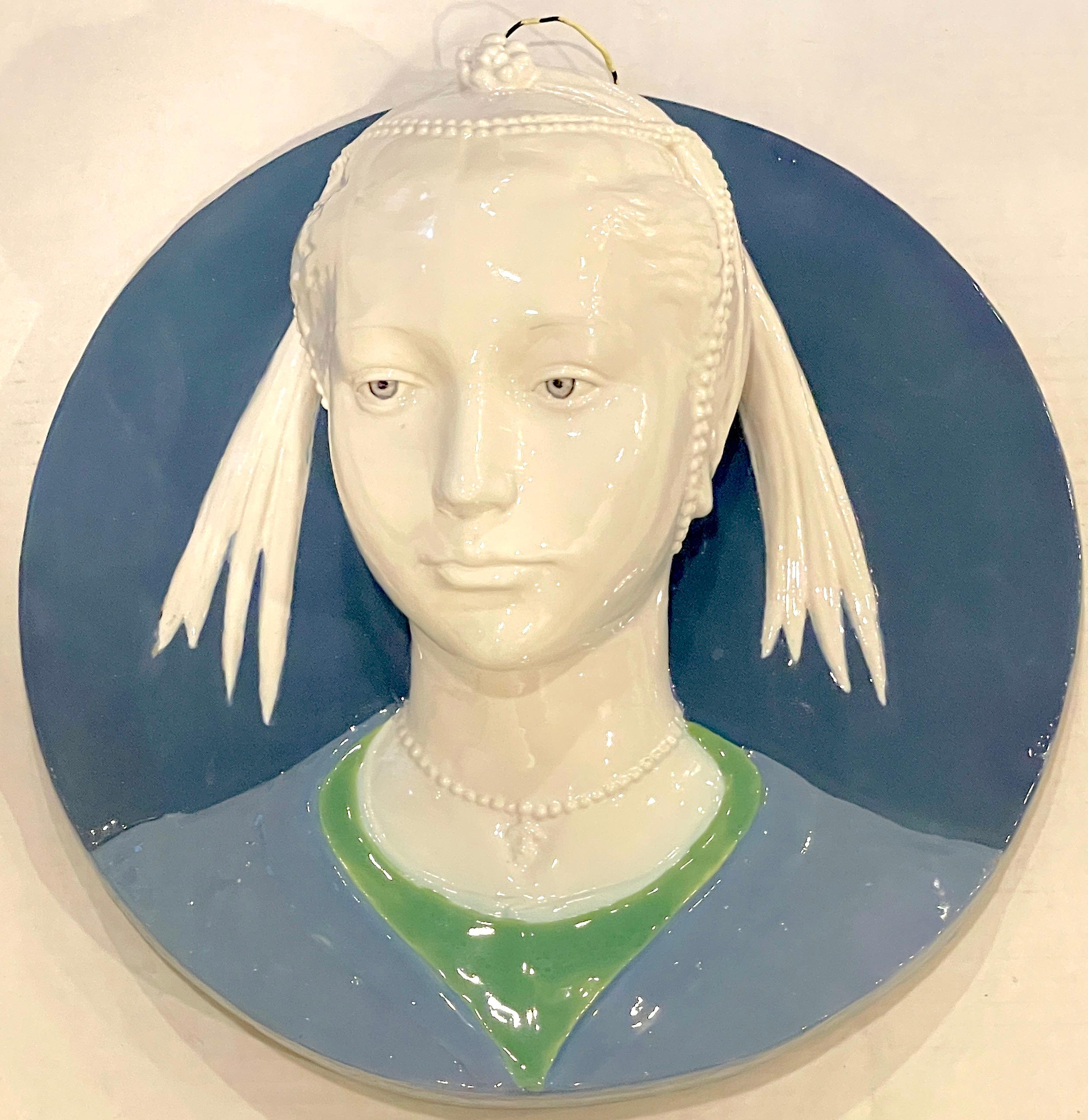 Della Robbia style sculpted portrait plaque of Jeweled Maiden, by Cantagalli
An impressive late 19th century example, subtly detailed, three dimensional circular portrait.


