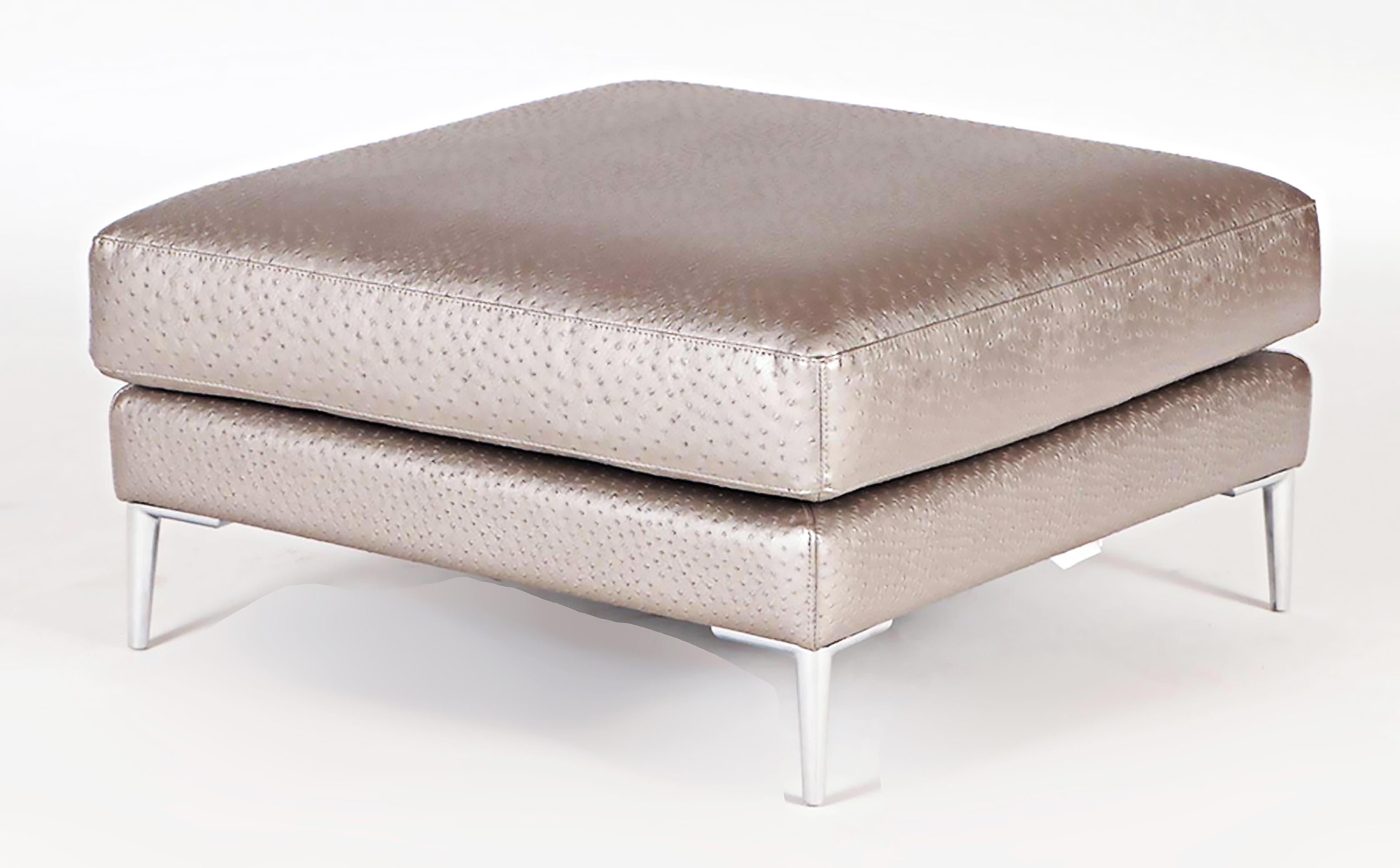 Dellarobbia faux ostrich leather and stainless steel ottoman.

Offered for sale is an elegant square leather ottoman by Dellarobbia. The leather on the ottoman is embossed with a faux-ostrich pattern. The ottoman is supported by stainless steel