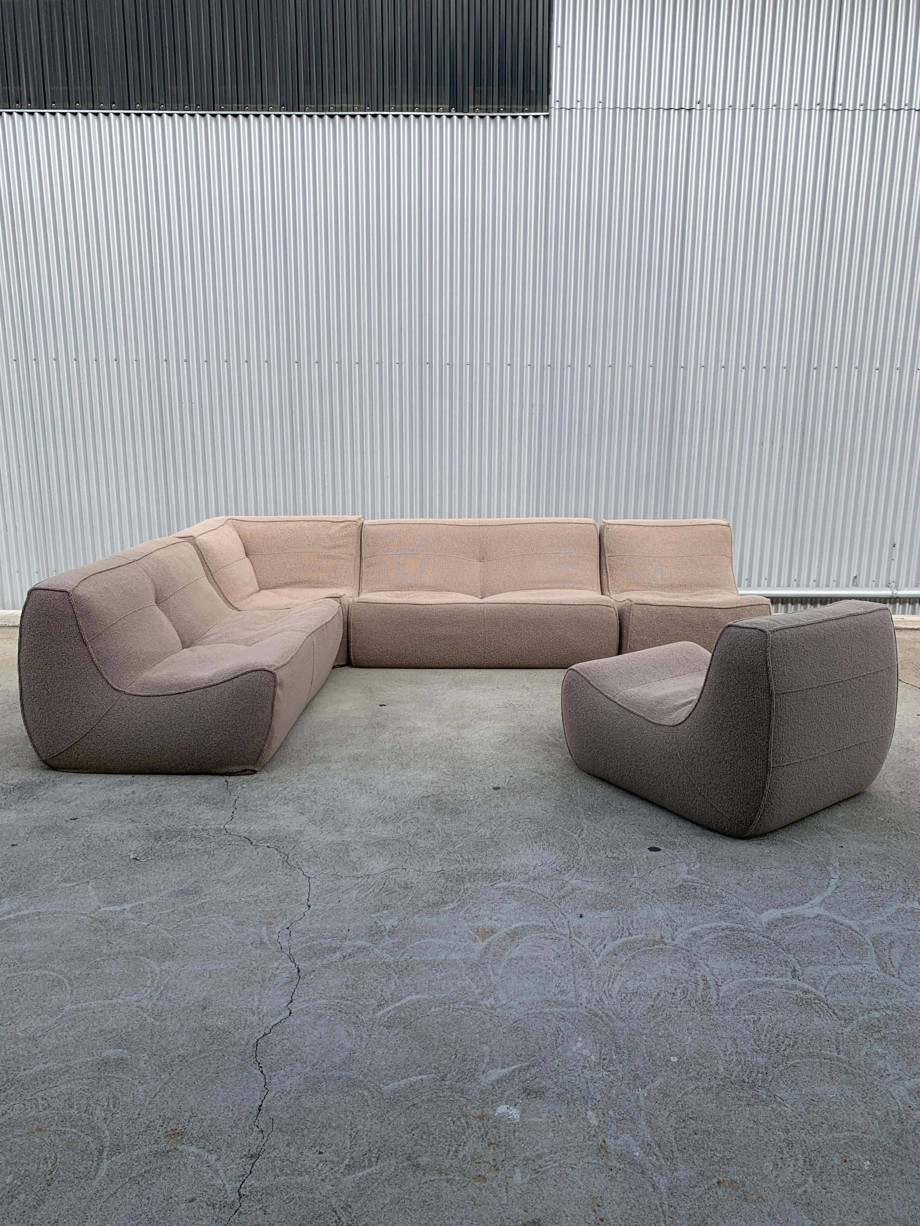 Plush foam and feather seat, and warm oatmeal boucle makes for instant relaxation while the contemporary styling makes for an interesting and sculptural scene.

Seating arrangement consists of 2 2-Seaters, 1 Corner, and 2 Chairs

Chair