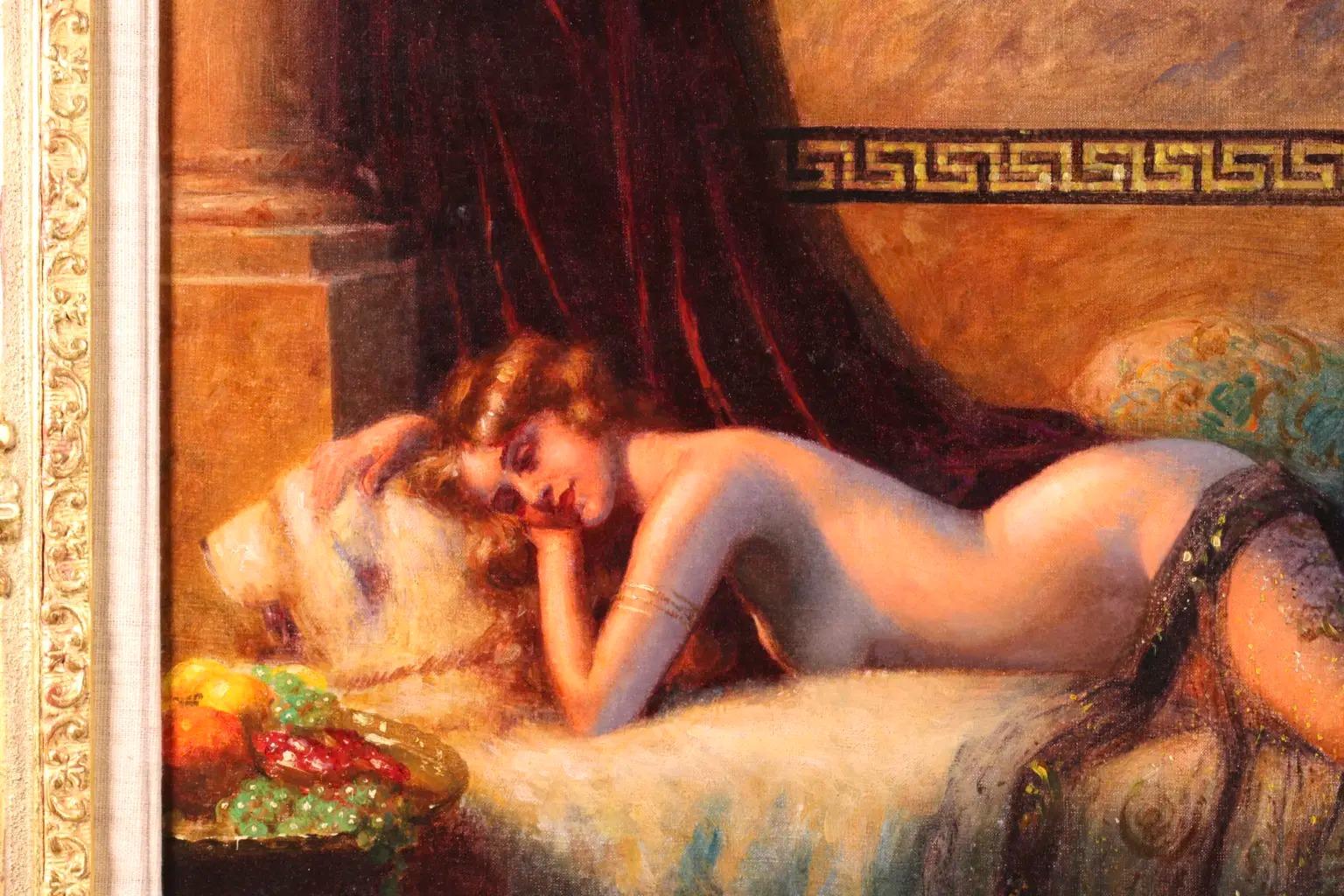 Signed nude in interior oil on canvas circa 1900 by French academic painter Delphin Enjolras. The piece depicts a red-haired nude resting on a bed in a lush boudoir with a sheer scarf draped over her. a deep red velvet curtain hangs behind her and a