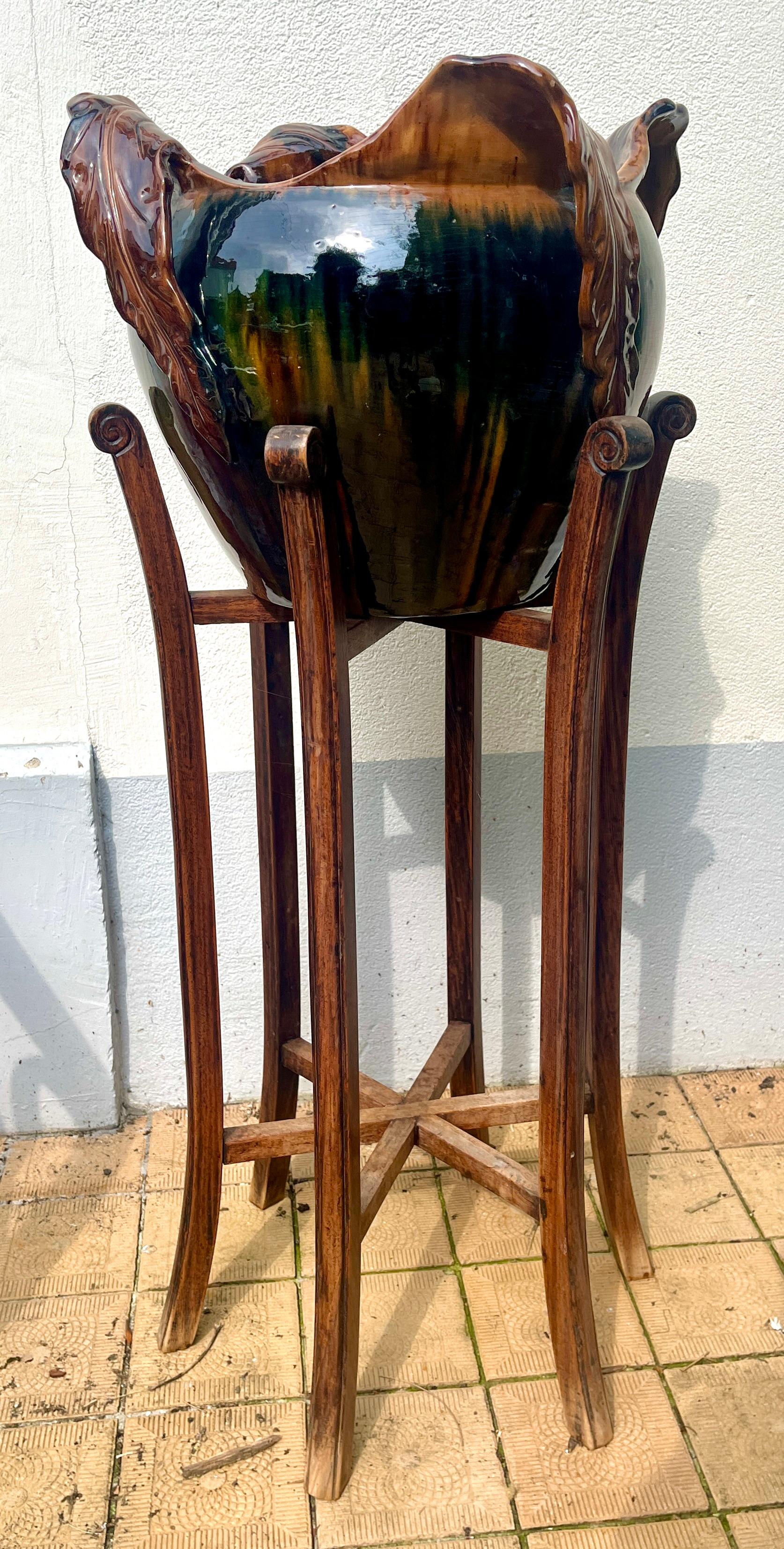Art Nouveau Majolica jardinière, planter with Oak stand Style of Delphin Massier & Fils at Vallauris 
This stylish piece is an early example by a renowned maker, showing the main inspirations of Art Nouveau, applying curved, organic and asymmetrical