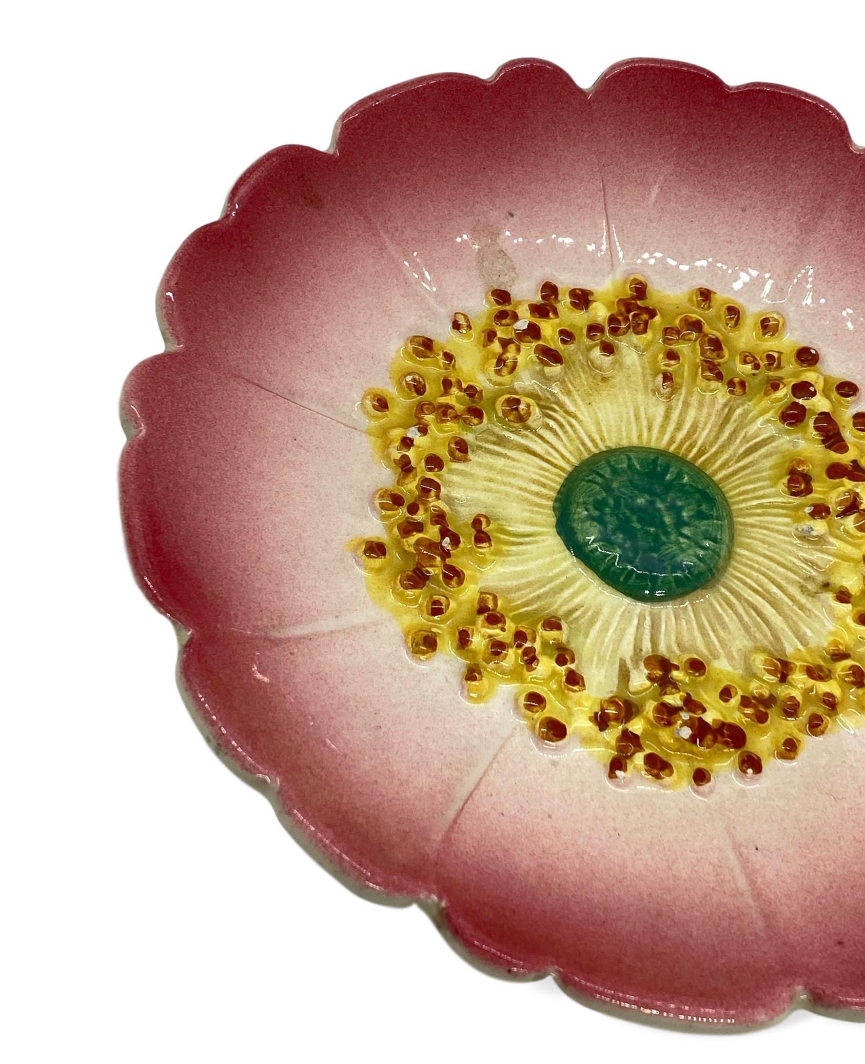 Delphin Massier Majolica (Barbotine) Trompe L'oeil pink flower plate, French, circa 1890, naturalistically molded as a rosehip flower. 
Measurements: Diameter 7.75 x Height 1.25.
For over 28 years we have been among the world's preeminent
