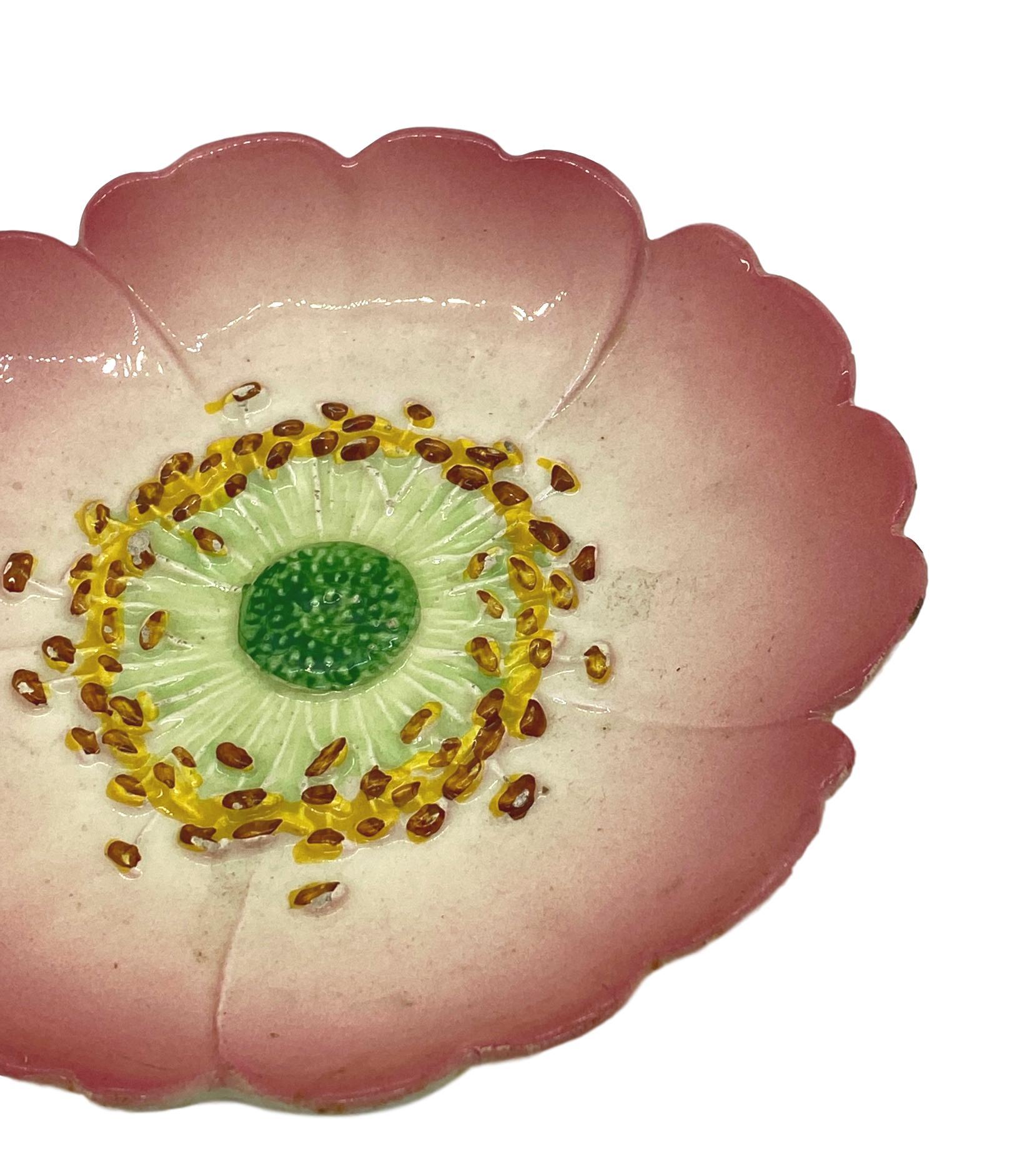 Delphin Massier Majolica (Barbotine) Trompe L'oeil pink flower plate, French, circa 1900, naturalistically molded as a rosehip flower, signed on reverse: 'Delphin Massier Vallauris A.M.' 
Measurements: Diameter 7.75 x Height 1.25.
For over 28