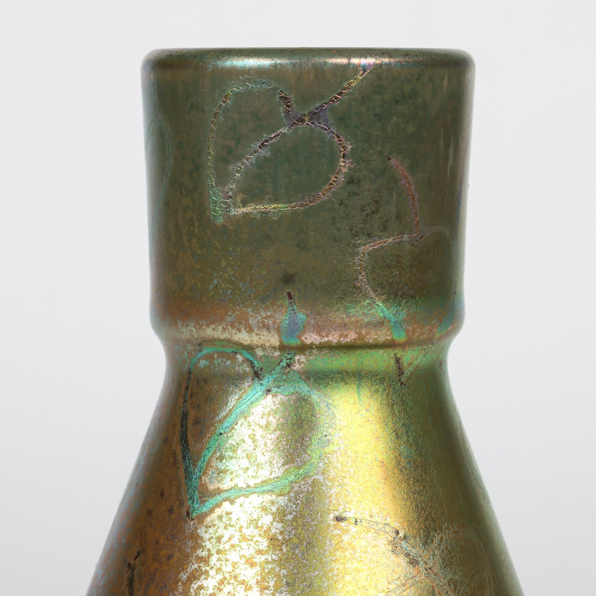 A stunning French art nouveau iridescent glazed vase decorated with leaves by renowned artist Delphin Massier (French, 1836-1907) probably dating from the 1890’s.

Delphin Massier, the older brother of Clement Massier, was born into a family of