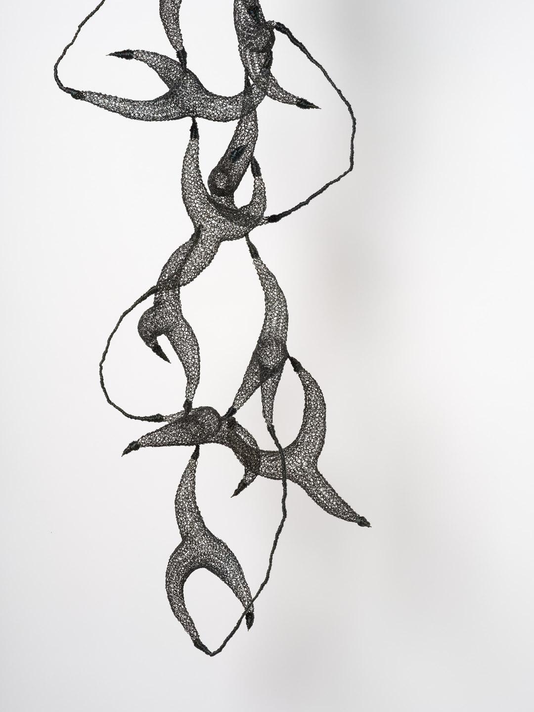 This woven metallic sculpture is created and shaped by Delphine Grandvaux directly from annealed iron wire.

As a new pronoun in French, 