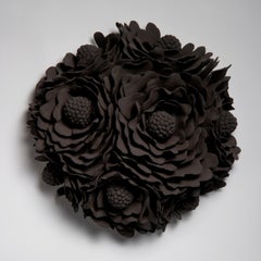 Delphine Wall Flower in Black, a stoneware wall mounted artwork by Vanessa Hogge