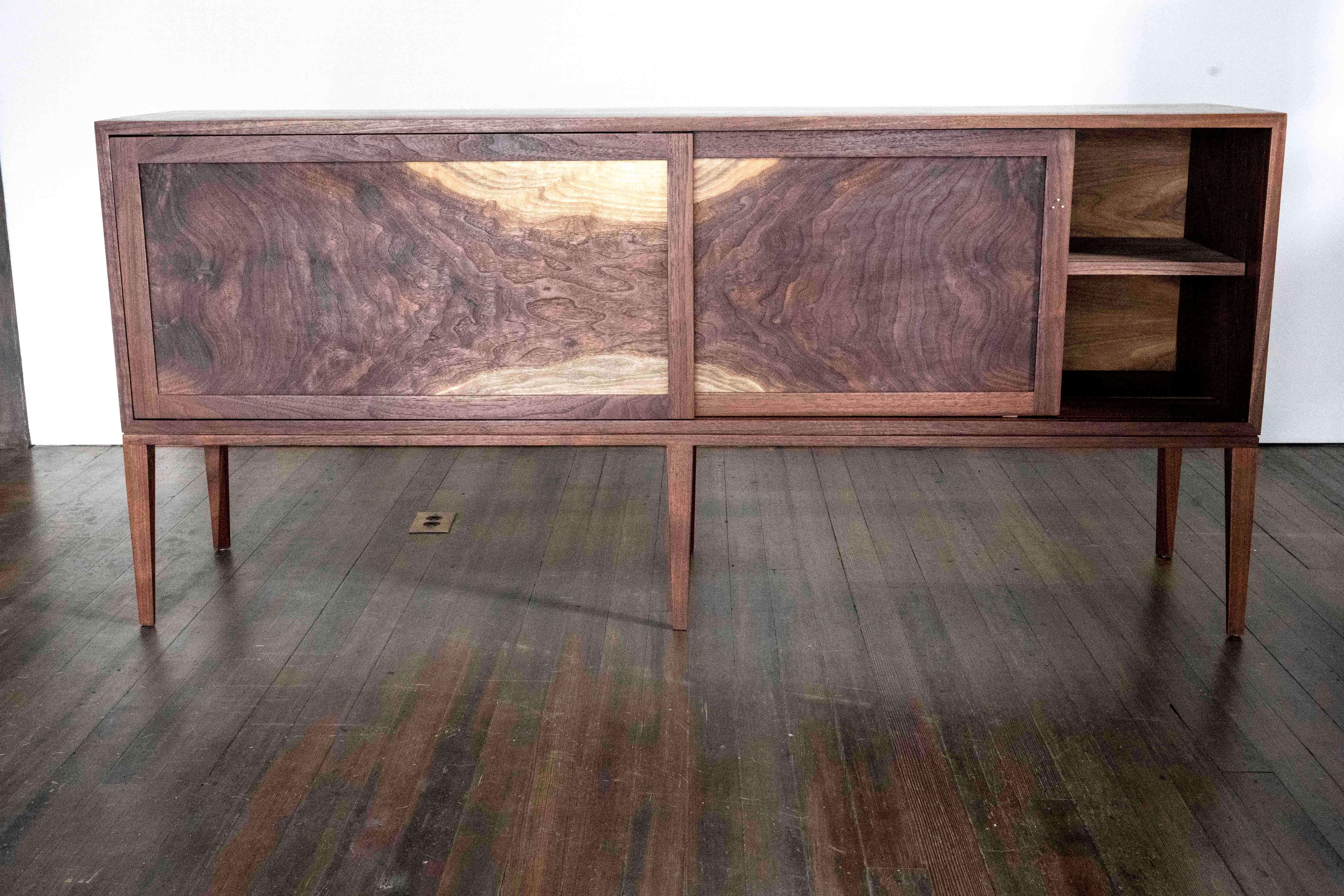 Modern Delta Cabinet in Walnut and Copper with Sliding Doors and Tapering Faceted Legs