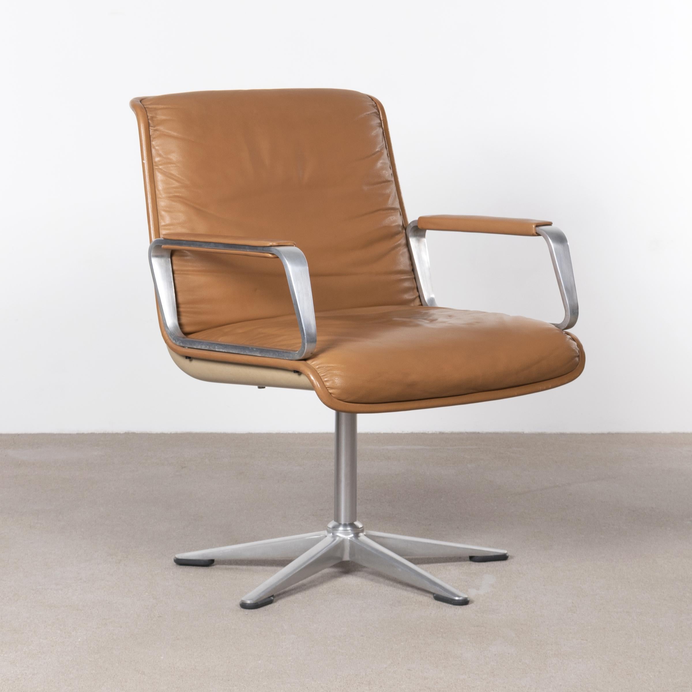 Soft pad chairs (Programm 2000) in Cognac leather for Wilkhahn designed by Delta Design (Michael Conrad, Detlef Unger and Henner Werner) in 1968. Aluminum polished (non-swivel) base with fiberglass seat shell padded with high quality leather. The