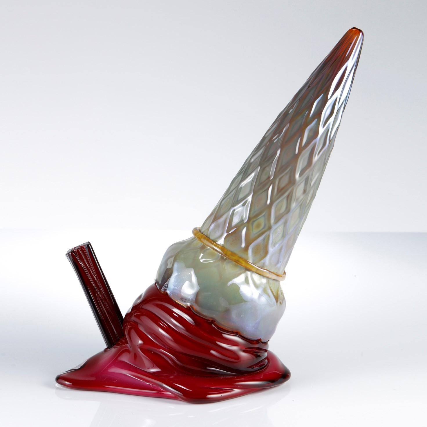 'Delusione with Flake in Gold & Raspberry' is a unique glass sculptural ice cream by the British artists, Bethany Wood & Elliot Walker.

Bethany Wood

Taking inspiration from a wide range of sources, Wood’s influences are taken directly from the