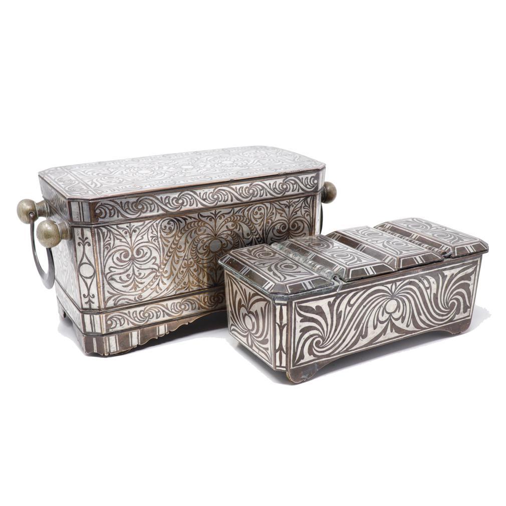 Deluxe Betel Nut Box Set, Maranao Culture, Southern Philippines (Mindanao). Two bronze rectangular boxes decorated with symmetrical silver inlay in the tendril vine pattern referred to as “the okir pattern”,  a traditional design for the Maranao