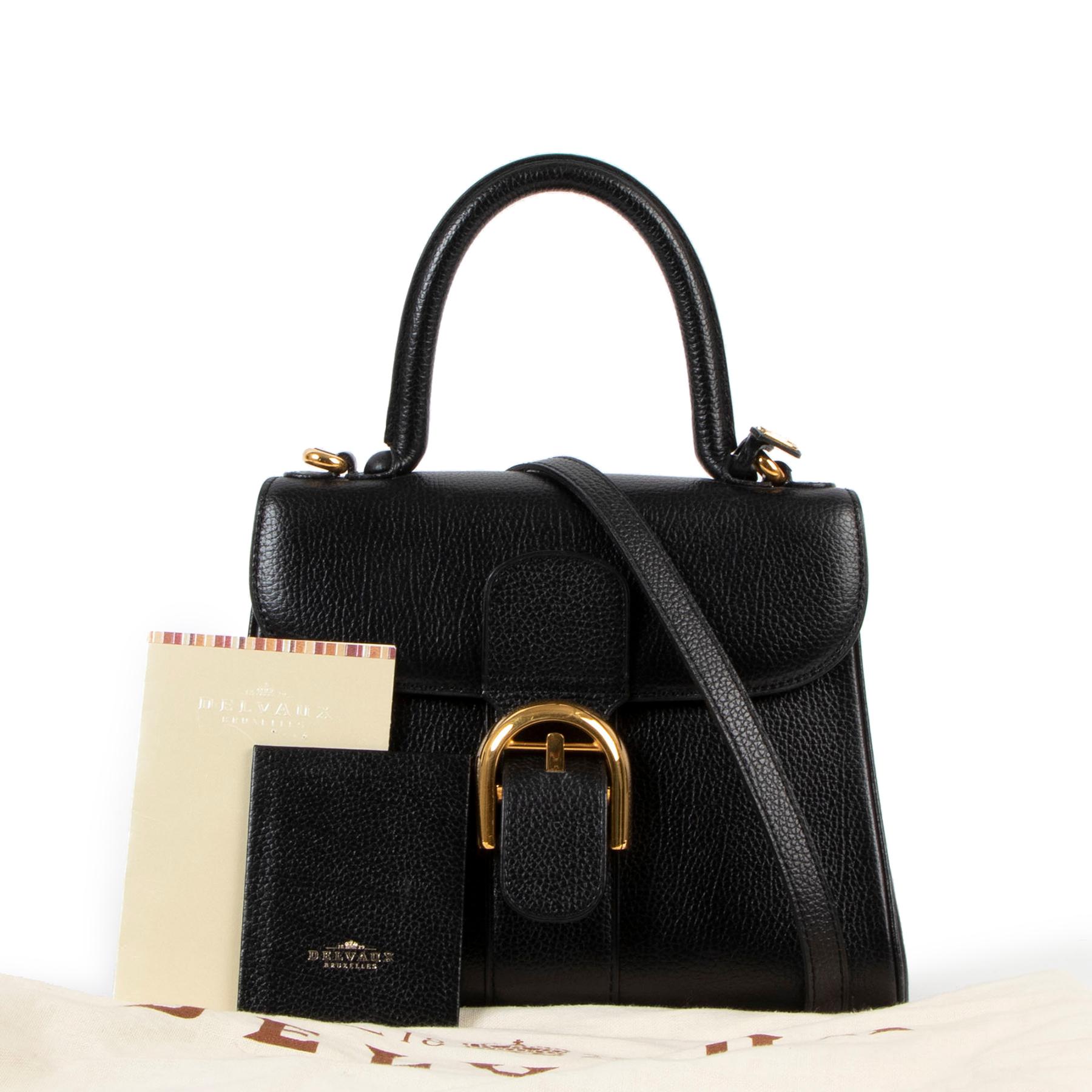 Delvaux Black Brillant PM Shoulder Bag

A classic that never goes out of fashion!

Made from grained black leather and finished with gold hardware, this Delvaux Brillant is the perfect addition to any bag collection. This one has a strap so you can