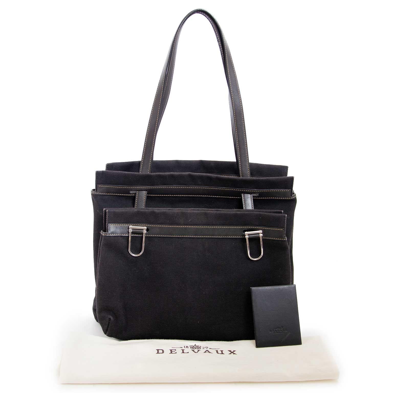 Good condition

Delvaux Black Fabric D Light Bag

This beautiful and classic Delvaux bag is crafted in black fabric and features leather stitched details. 
The bag consists of two seperate bags, that you can wear together or seperately. 
A truely