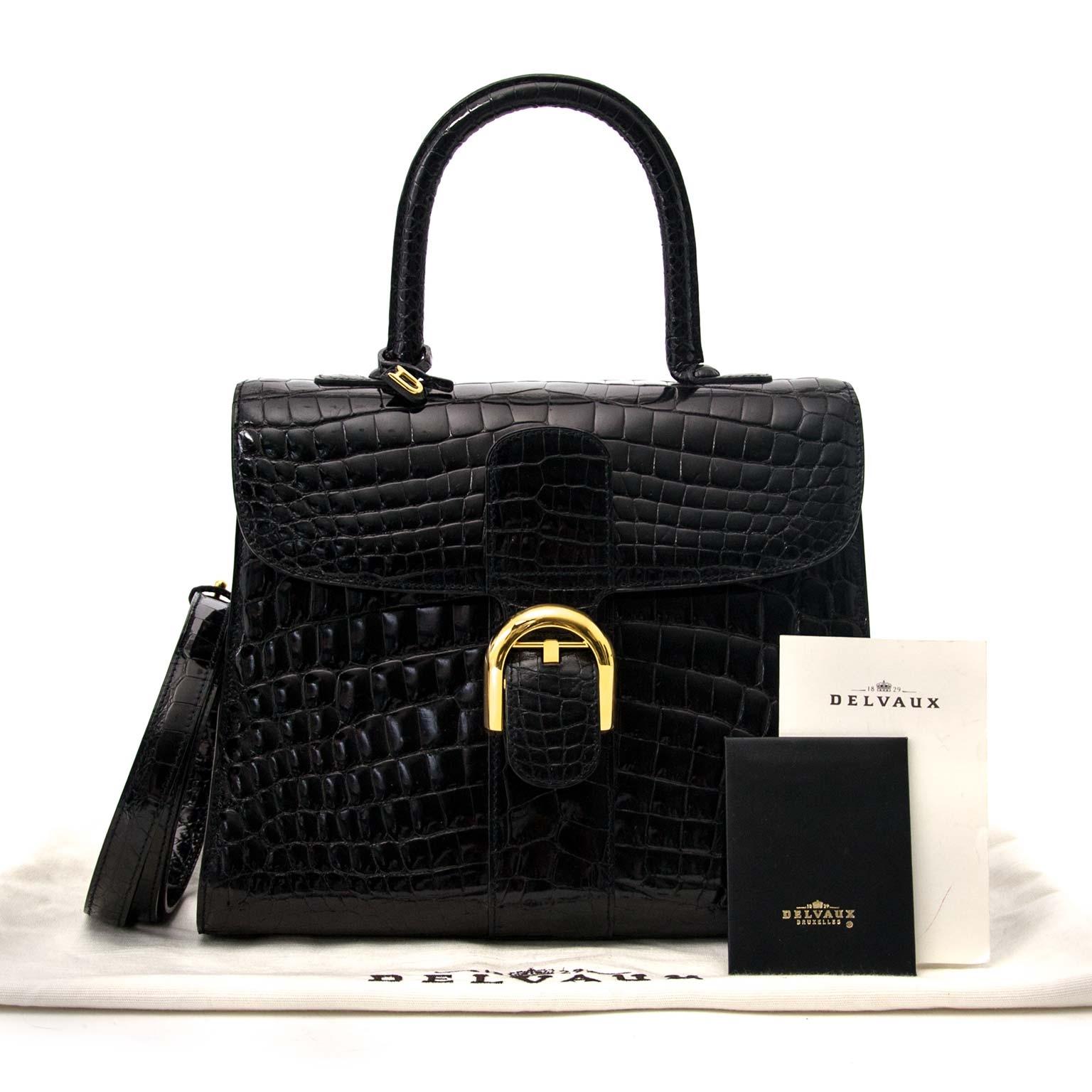 As new, only worn a few times

Delvaux Brillant MM Crocodile black with golden hardware + strap

Est. retail Price : € 24.000

The most iconic bag of Delvaux's design, the Brillant requires exceptional craftsmanship and skill.

Made out of no fewer