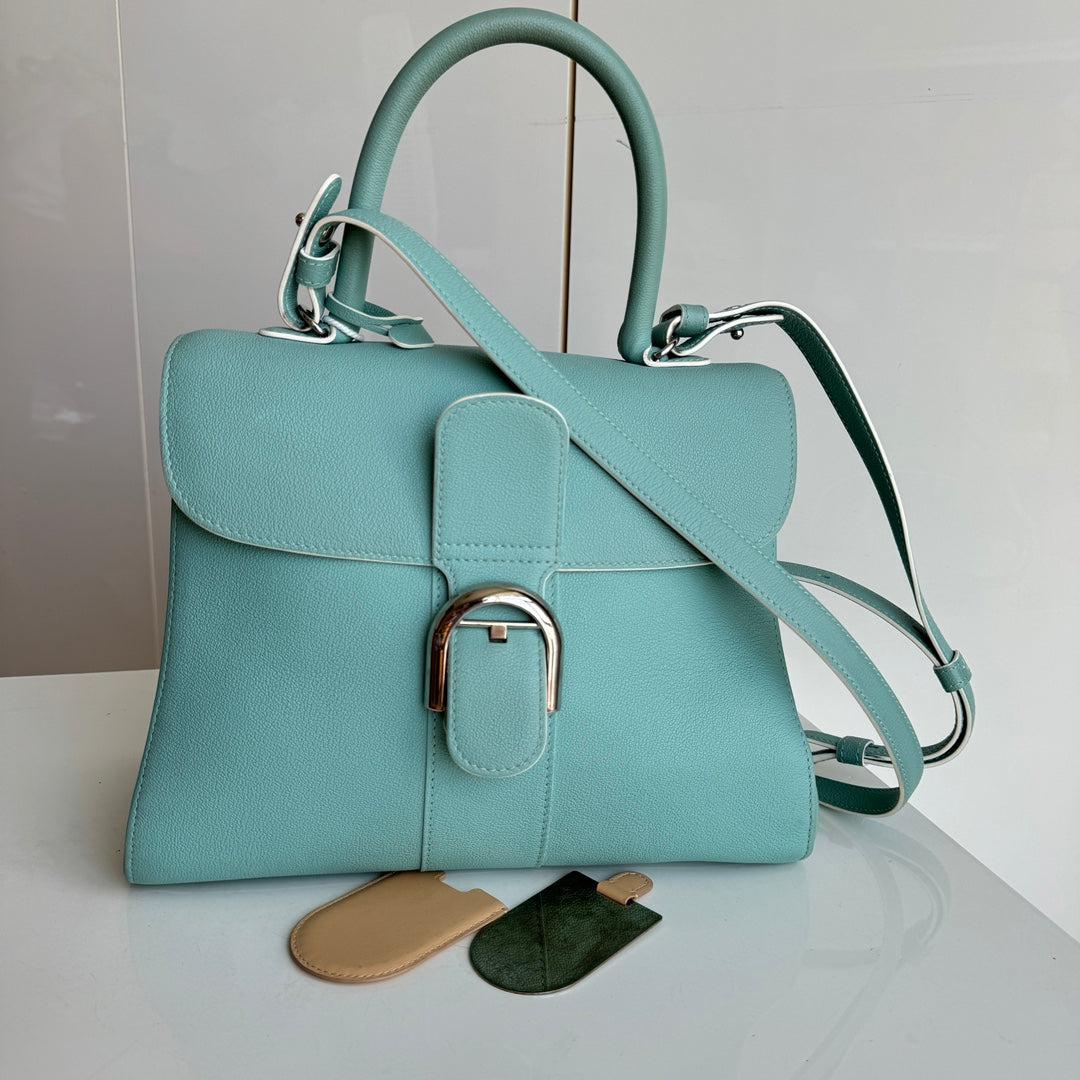 Delvaux Brilliant MM Medium Bright Tiffany Blue Calfskin Leather Crossbody Bag
  These are professional photos of the actual bag offered by Luxbags.
  Discontinued in 2015, the Grand Shopping tote bag is one CHANEL rarity that is highly treasured.